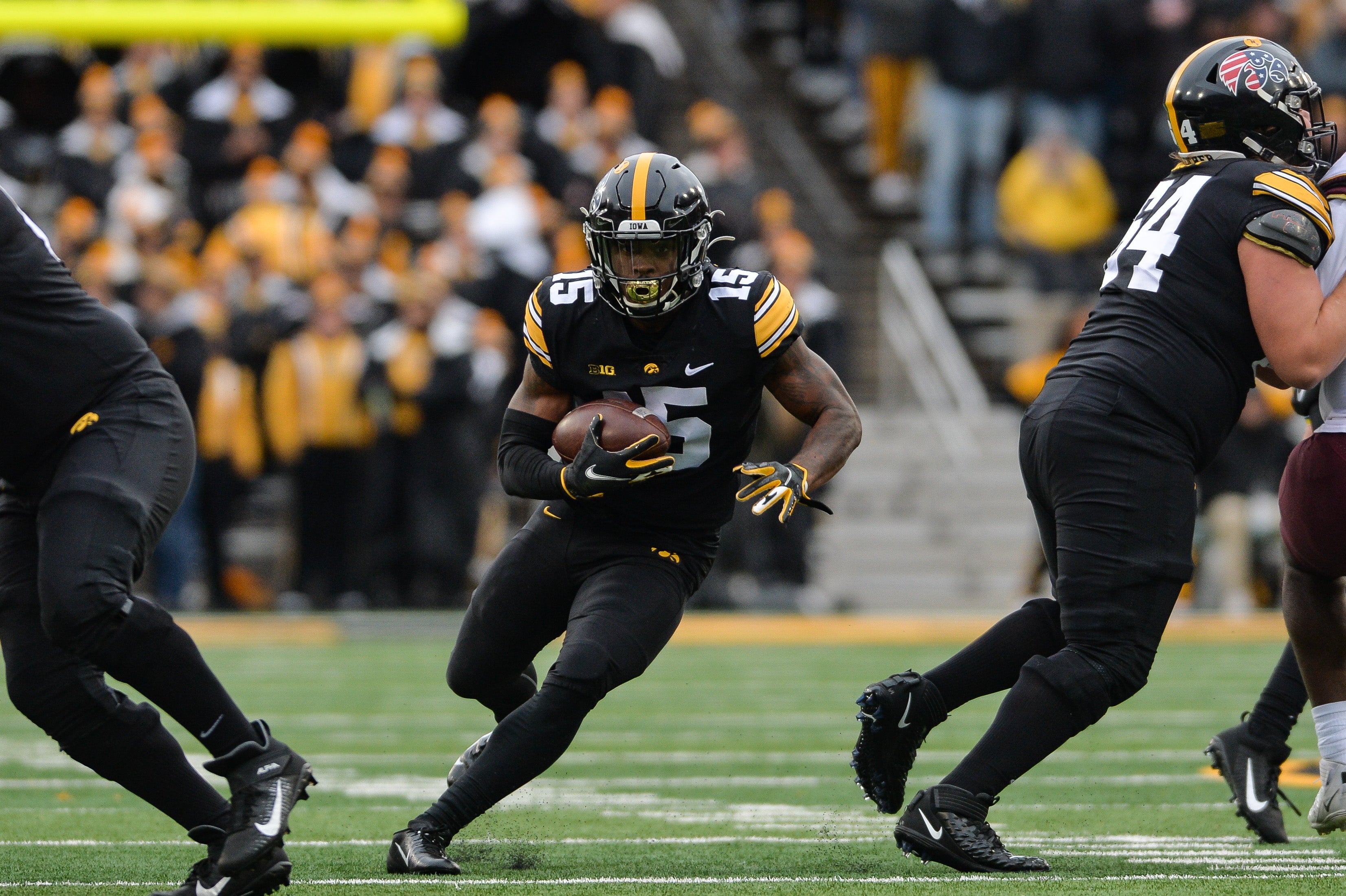 Nov 13, 2021; Iowa City, Iowa, USA; Iowa Hawkeyes running back Tyler Goodson (15) runs the ball against the Minnesota Golden Gophers during the first quarter at Kinnick Stadium.