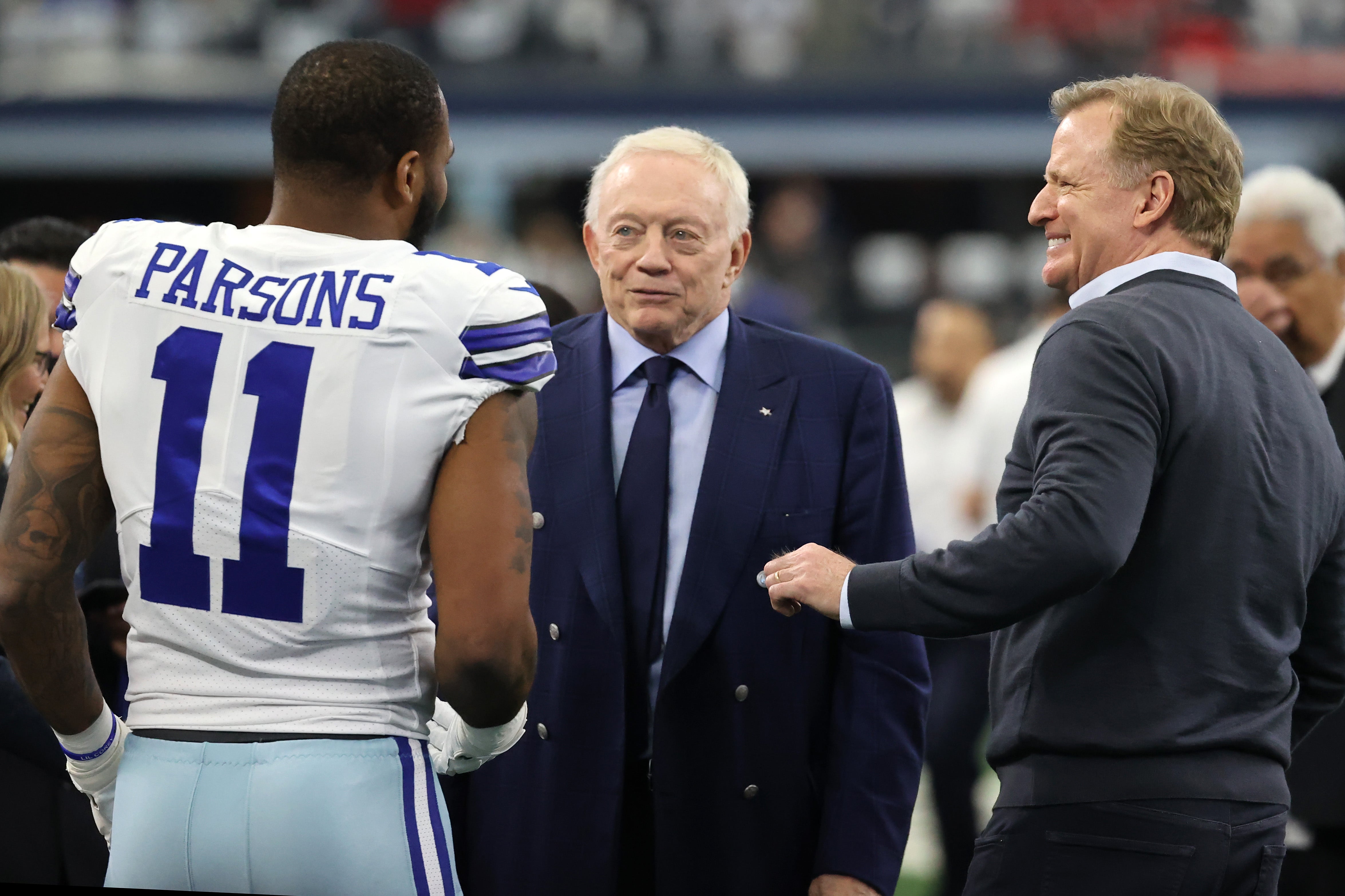 Dallas Cowboys outside linebacker Micah Parsons (11) meets with owner Jerry Jones (center) and NFL commissioner Roger Goodell (right) prior to the NFC Wild Card playoff football game against the San Francisco 49ers at AT&T Stadium.