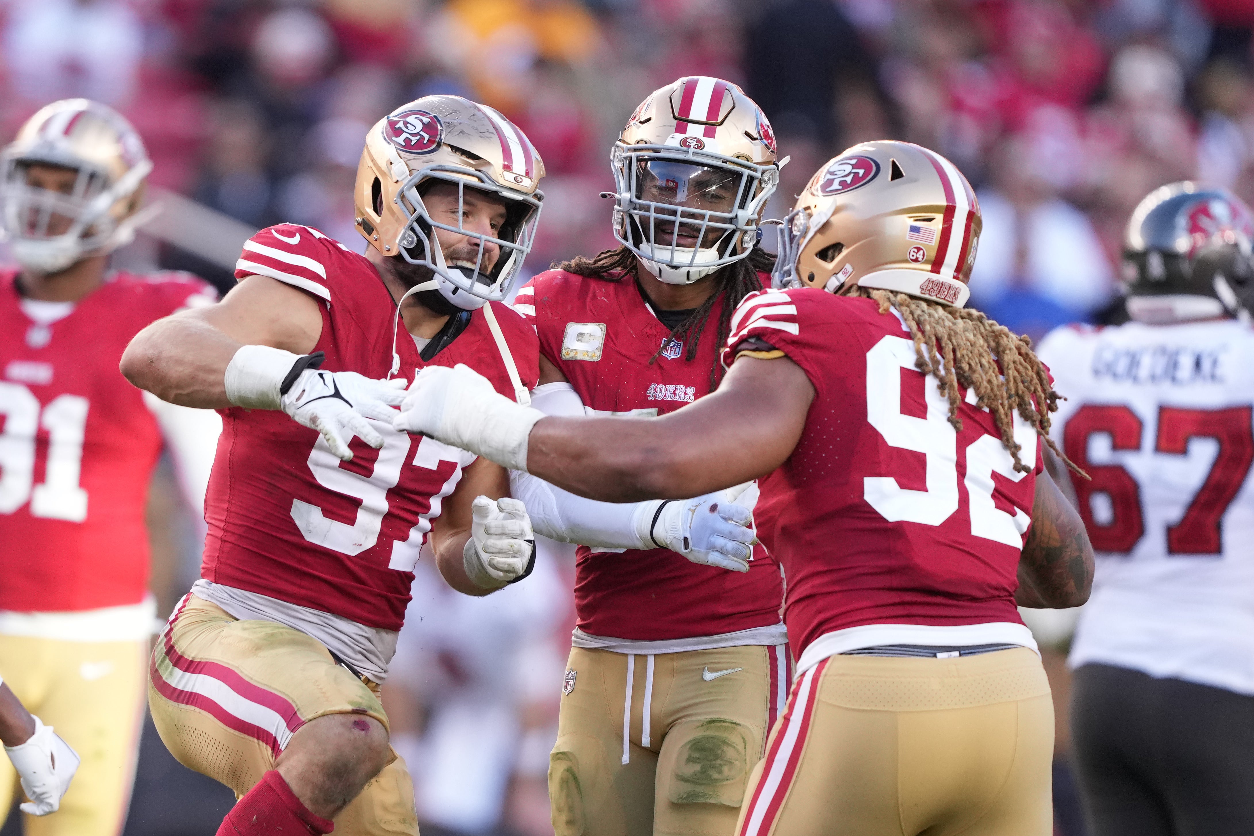 Nov 19, 2023; Santa Clara, California, USA; San Francisco 49ers defensive end Chase Young (92) is congratulated by defensive end Nick Bosa (97) after recording a sack against the Tampa Bay Buccaneers during the fourth quarter at Levi's Stadium.
