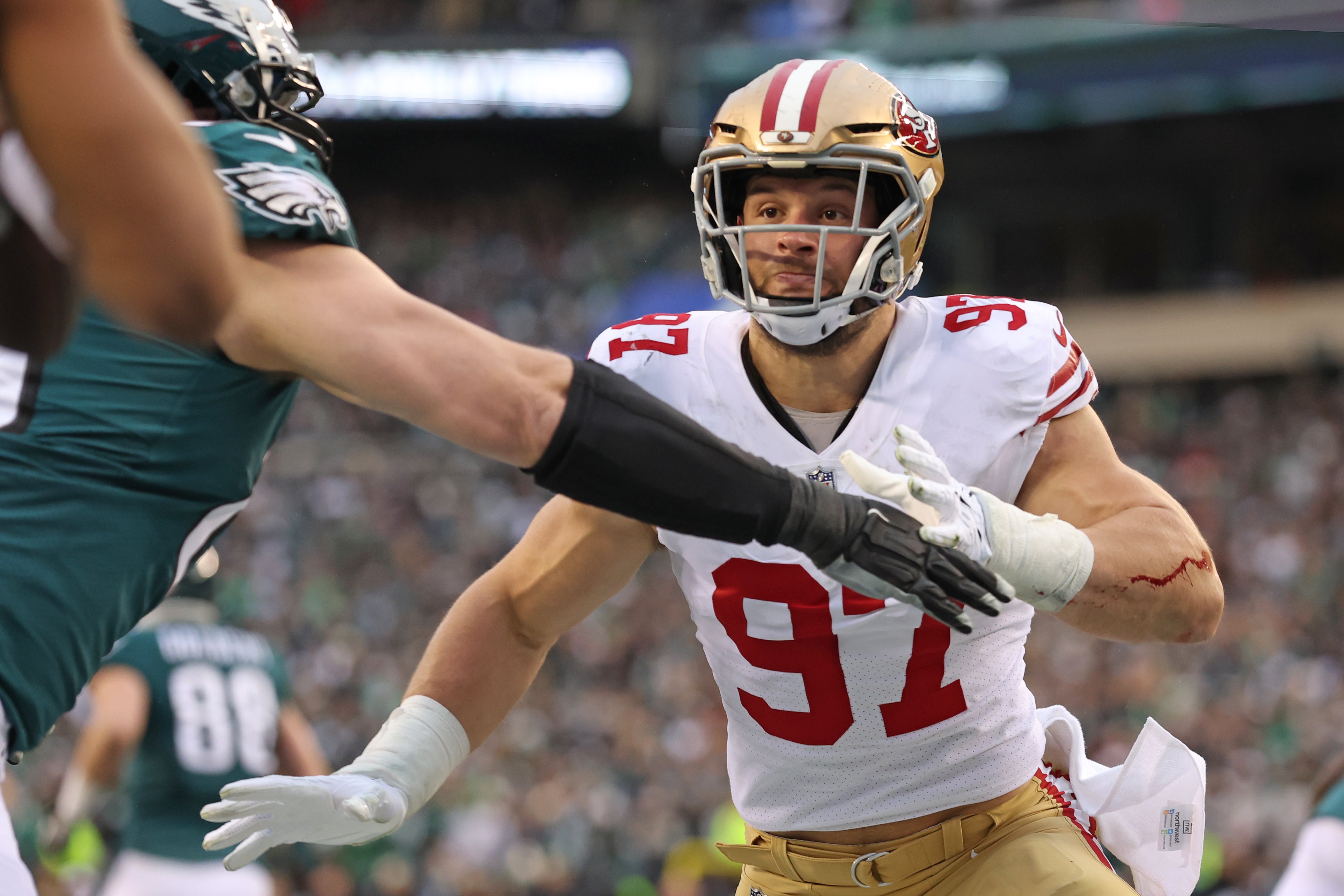 Jan 29, 2023; Philadelphia, Pennsylvania, USA; San Francisco 49ers defensive end Nick Bosa (97) battles with Philadelphia Eagles offensive tackle Lane Johnson (65) during the second quarter in the NFC Championship game at Lincoln Financial Field.