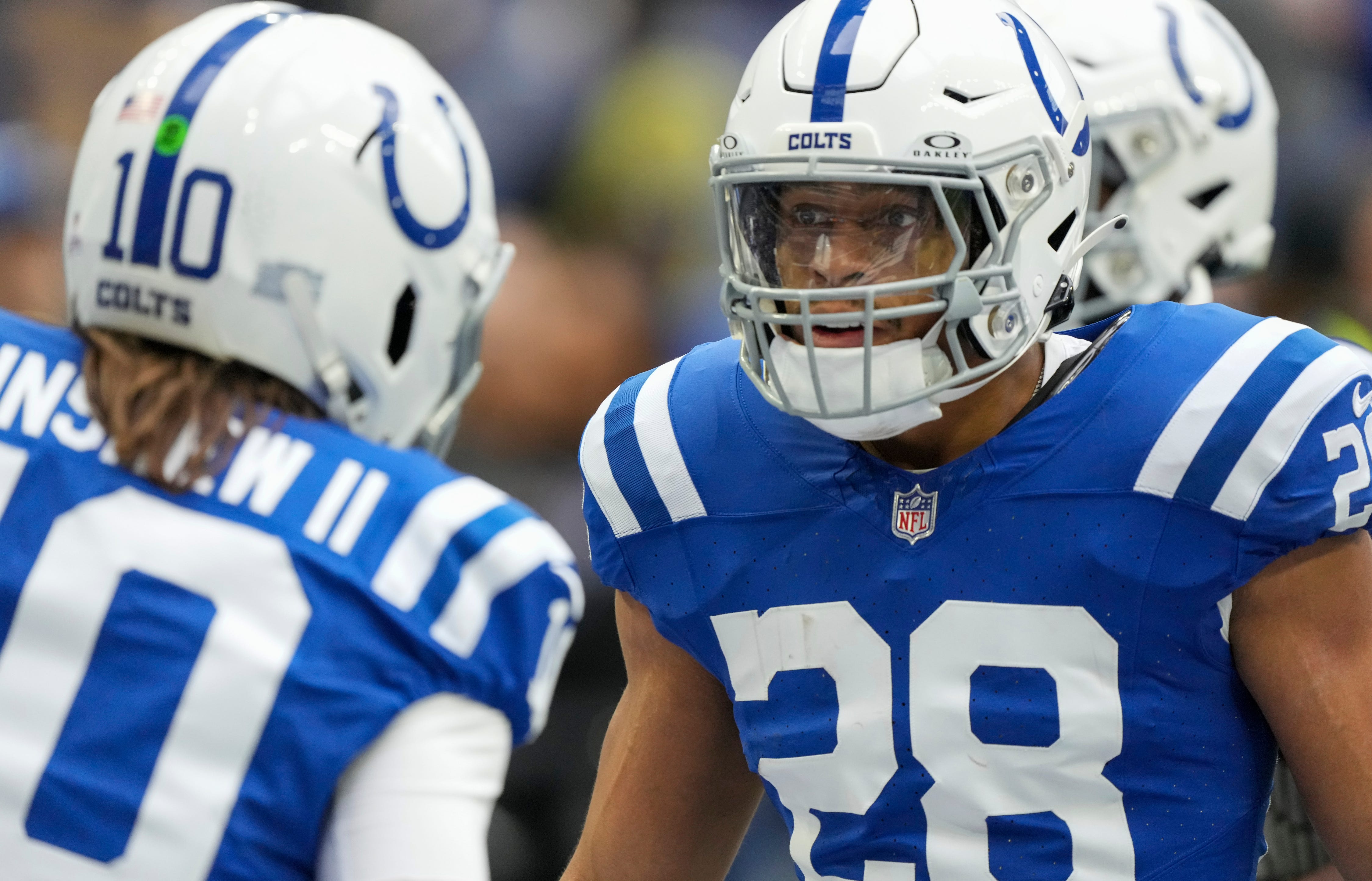 Indianapolis Colts running back Jonathan Taylor (28) chats with Indianapolis Colts quarterback Gardner Minshew (10) during pregame against the Titans on Sunday, Oct. 8, 2023, at Lucas Oil Stadium in Indianapolis.