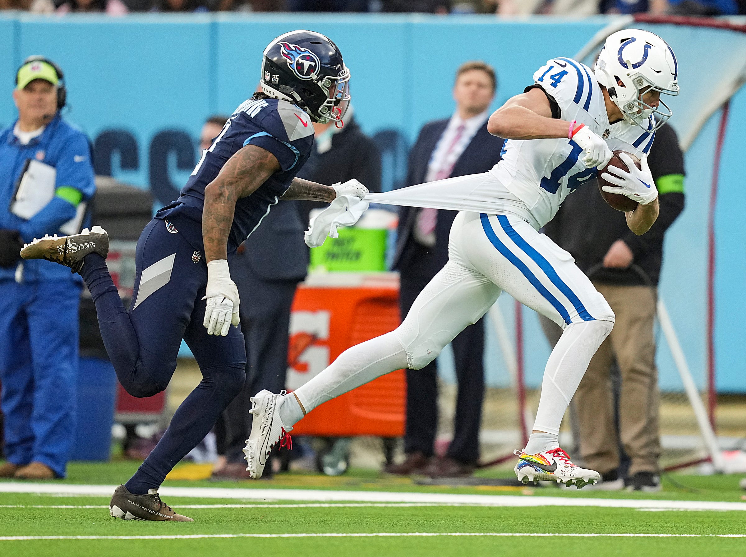Indianapolis Colts wide receiver Alec Pierce (14) receives a long pass to put the Colts at first and goal in overtime Sunday, Dec. 3, 2023, at Nissan Stadium in Nashville, Tenn. The Colts went on to score to win in overtime, 31-28.