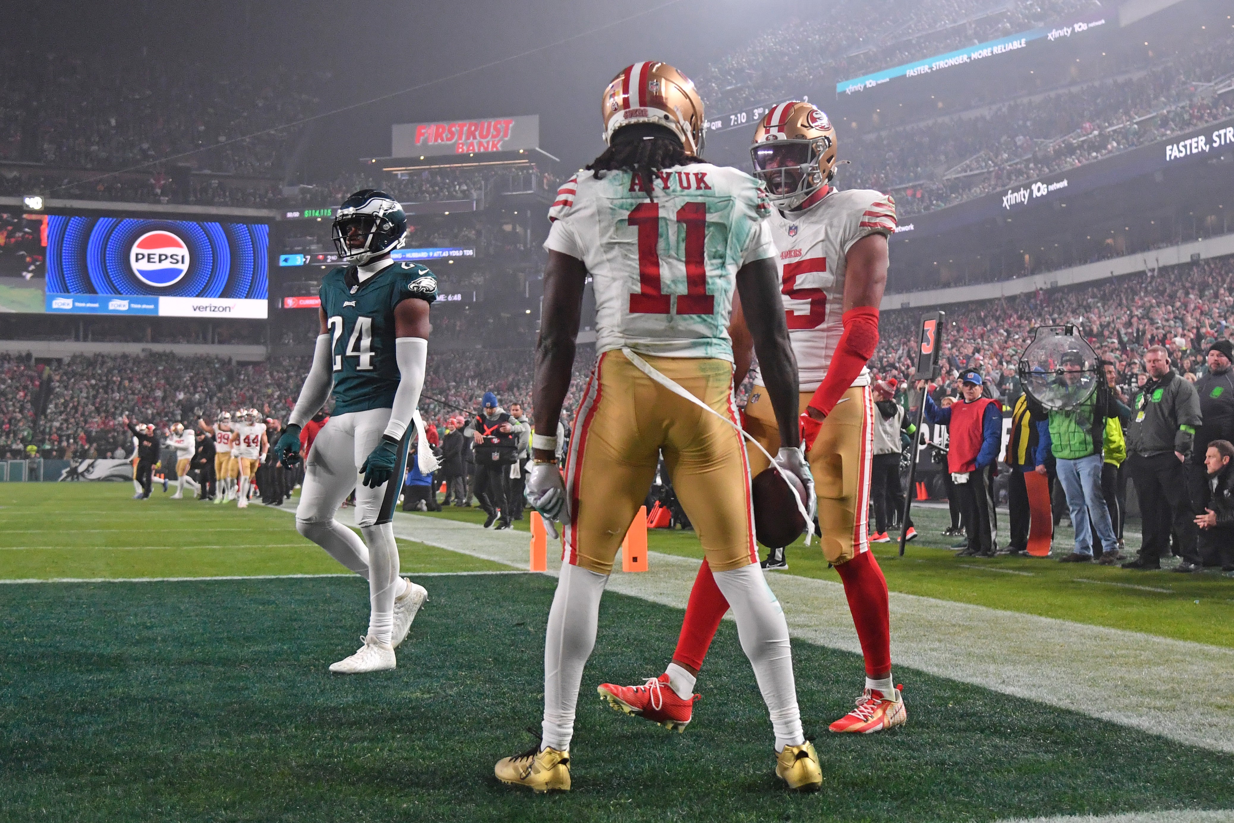 Dec 3, 2023; Philadelphia, Pennsylvania, USA; San Francisco 49ers wide receiver Brandon Aiyuk (11) celebrates his touchdown catch with wide receiver Jauan Jennings (15) against the Philadelphia Eagles during the second quarter at Lincoln Financial Field.