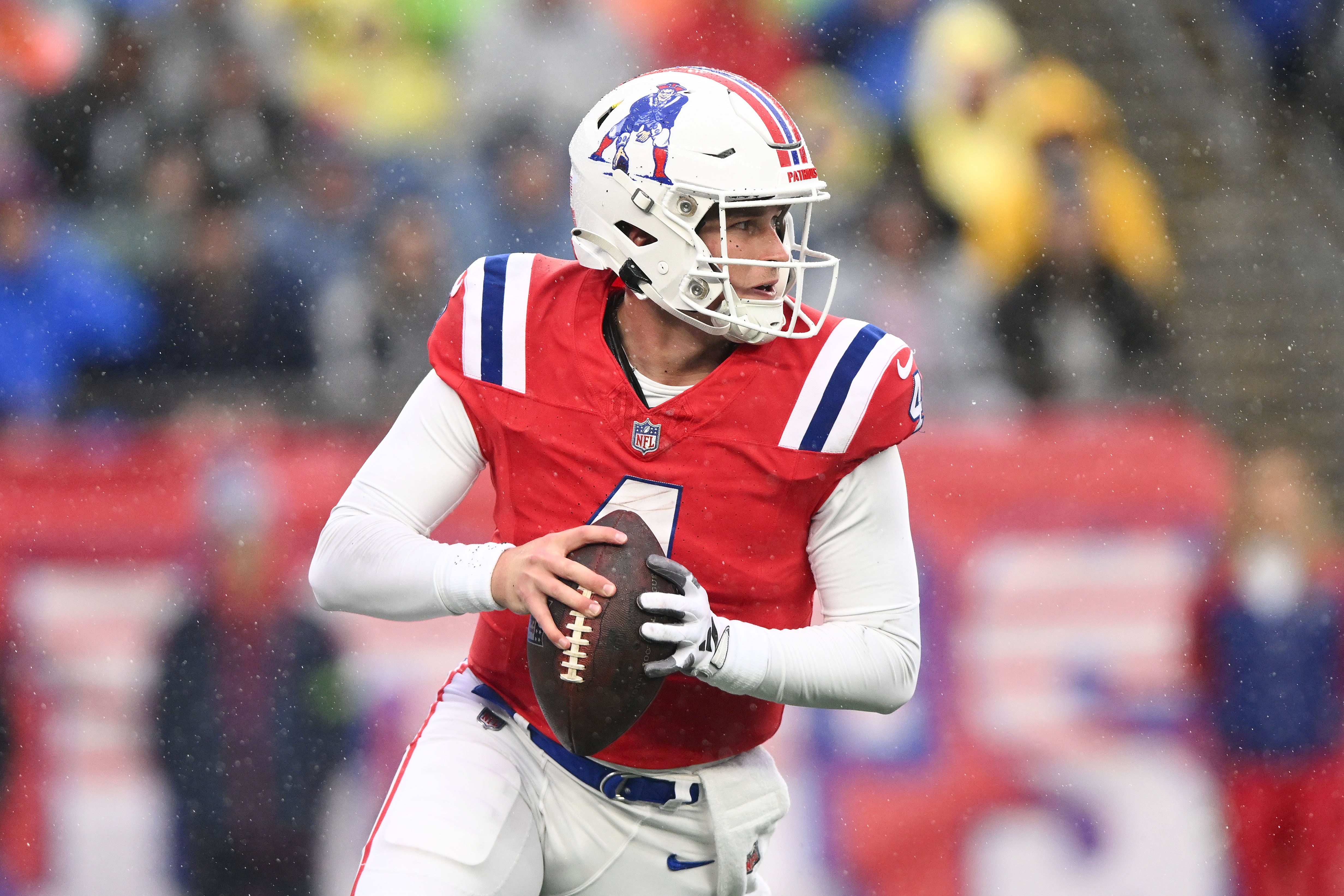 New England Patriots quarterback Bailey Zappe  looks to throw against the Los Angeles Chargers during the first half at Gillette Stadium