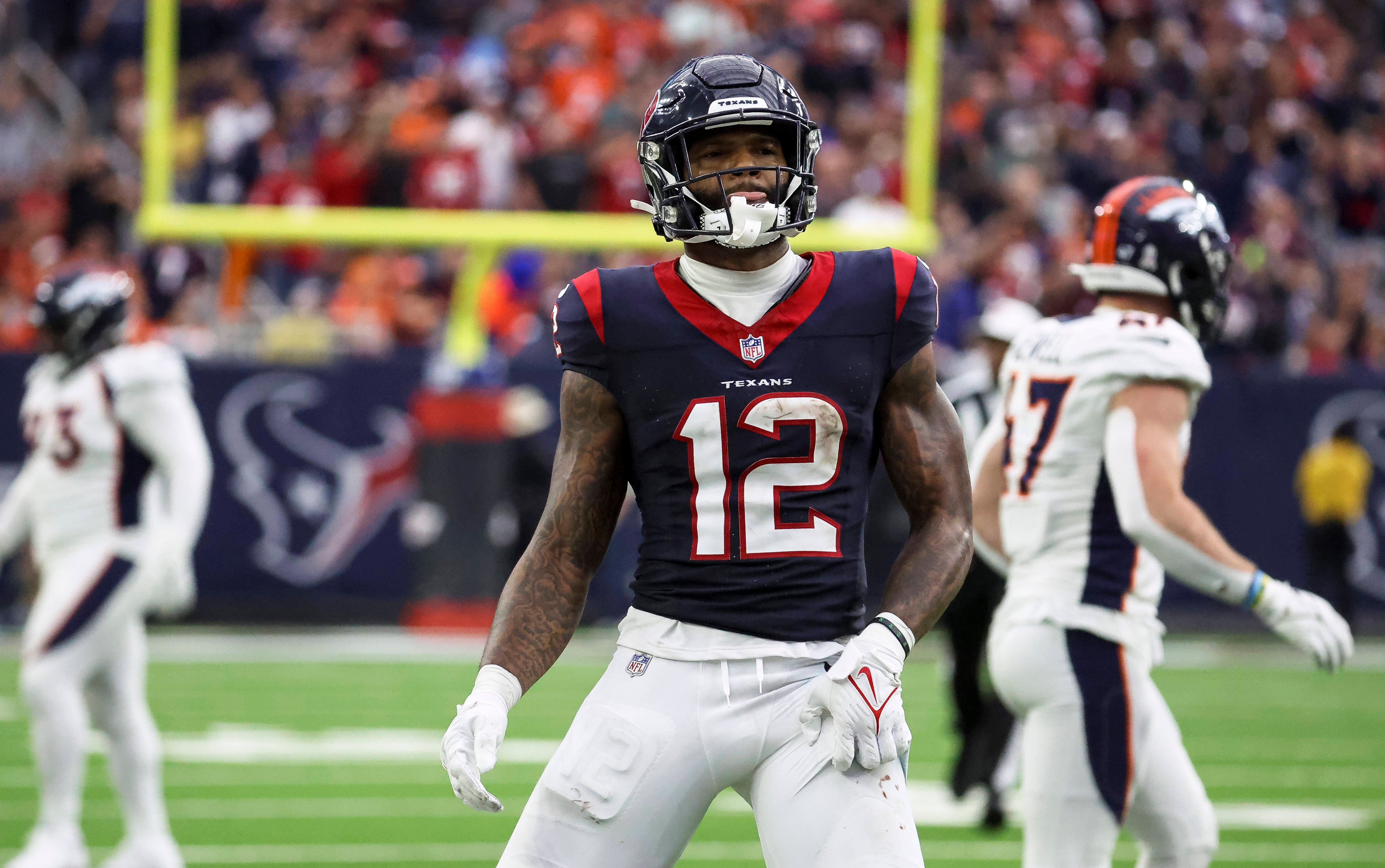 Dec 3, 2023; Houston, Texas, USA; Houston Texans wide receiver Nico Collins (12) reacts after making a reception during the fourth quarter against the Denver Broncos at NRG Stadium.