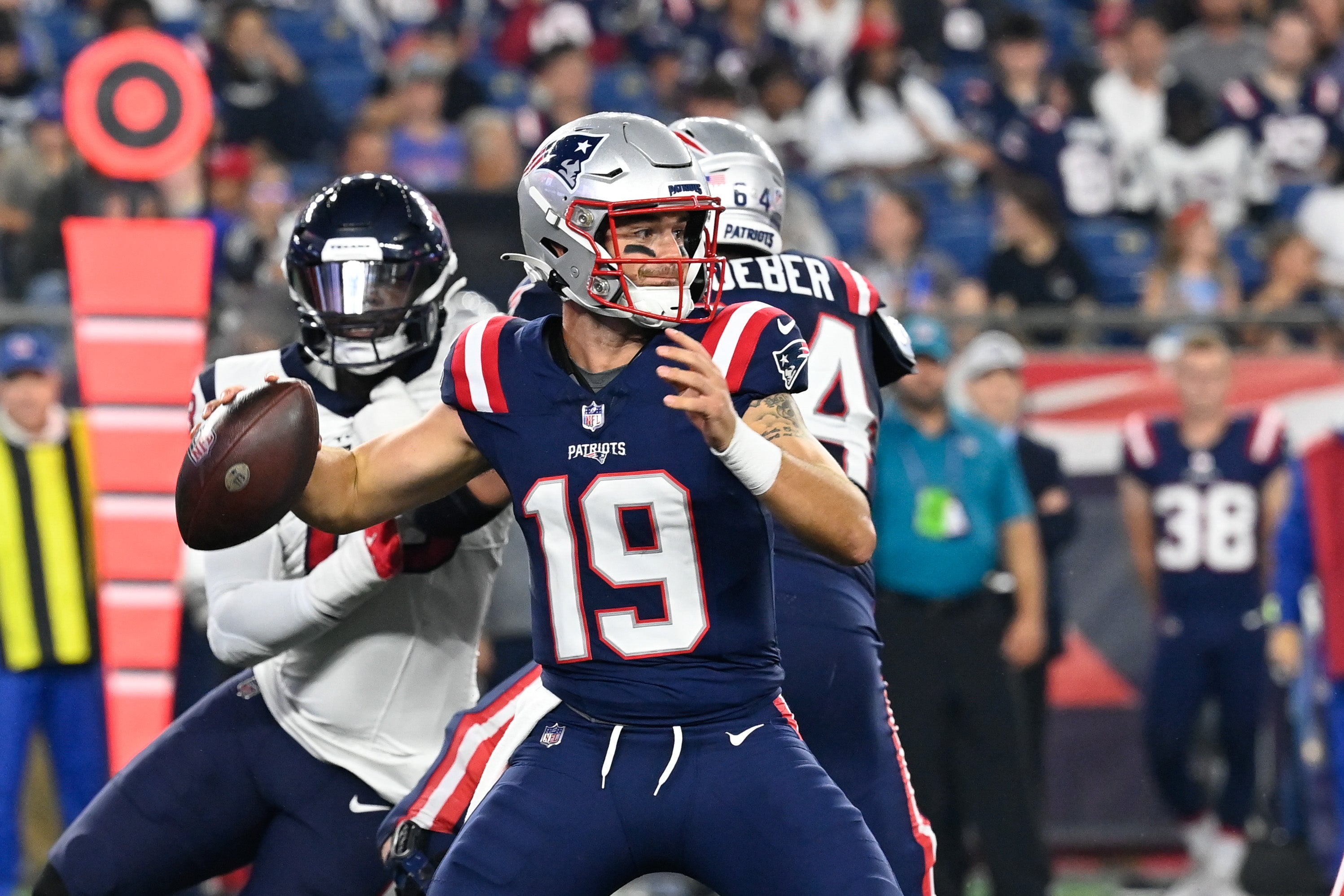 Aug 10, 2023; Foxborough, Massachusetts, USA; New England Patriots quarterback Trace McSorley (19) drops back to pass during the second half against the Houston Texans at Gillette Stadium. Mandatory Credit: Eric Canha-USA TODAY Sports