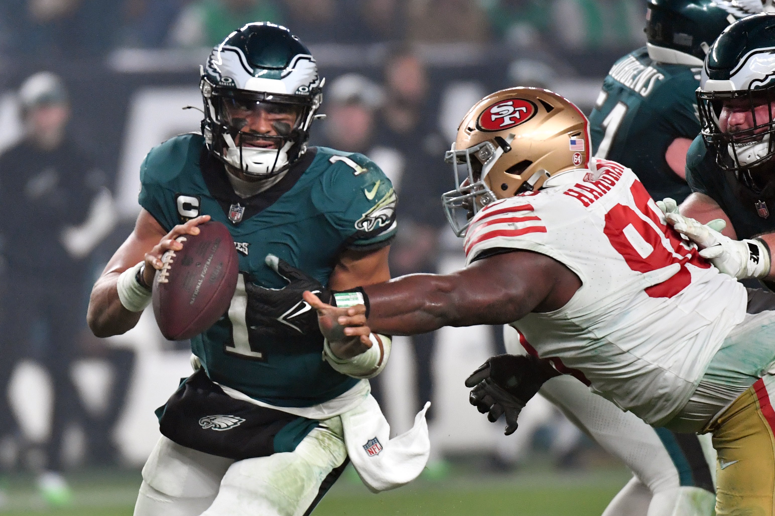 Dec 3, 2023; Philadelphia, Pennsylvania, USA; Philadelphia Eagles quarterback Jalen Hurts (1) is tackled by San Francisco 49ers defensive tackle Javon Hargrave (98) during the fourth quarter at Lincoln Financial Field.