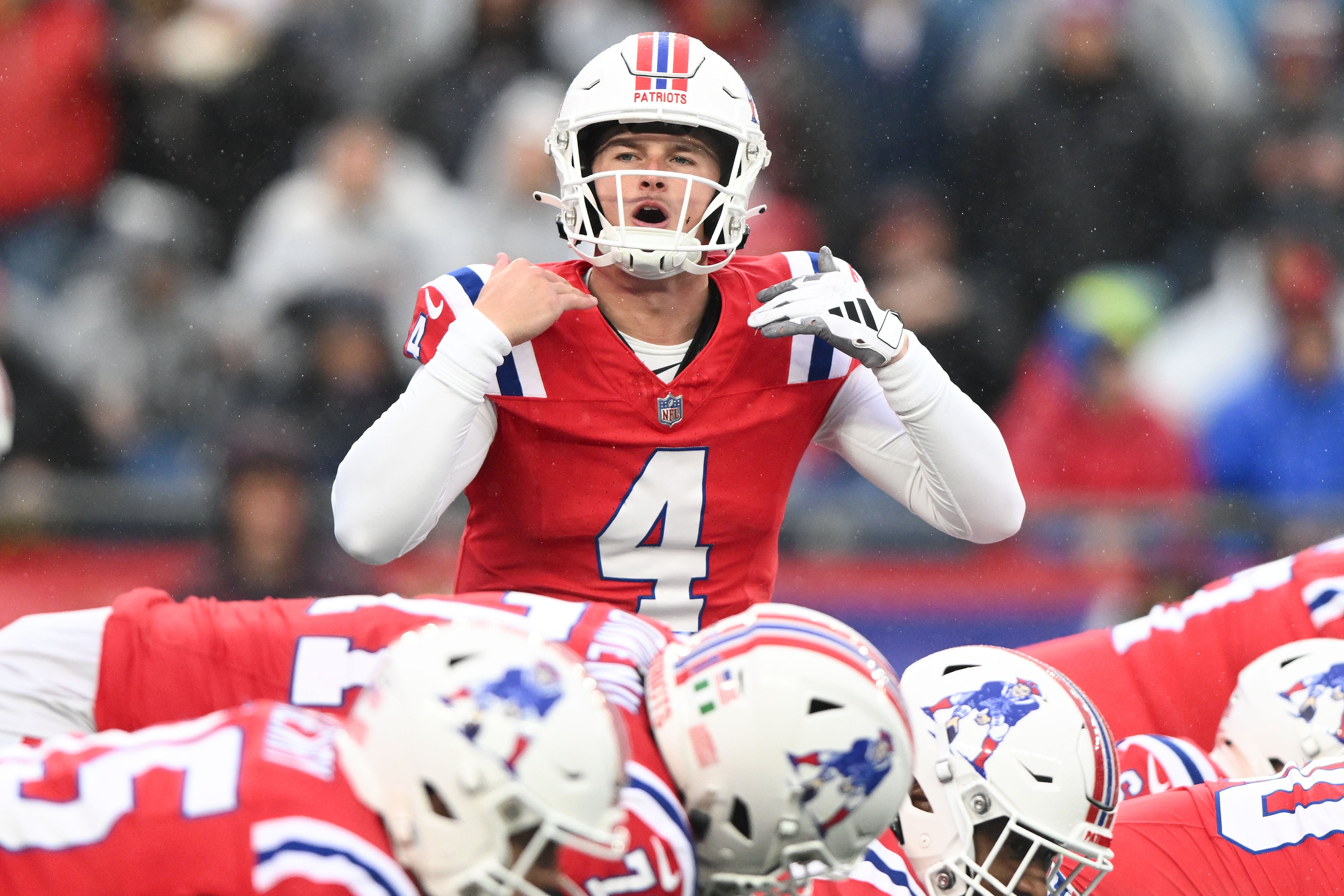 New England Patriots quarterback Bailey Zappe calls a play against the Los Angeles Chargers during the first half at Gillette Stadium.