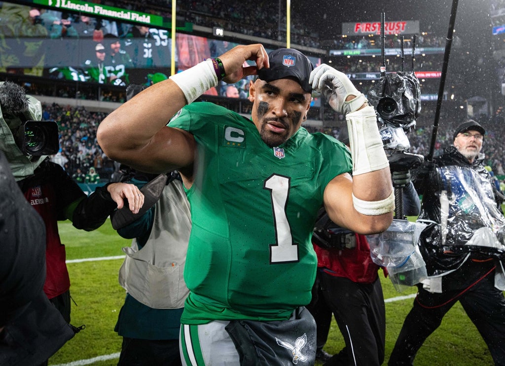 Philadelphia Eagles quarterback Jalen Hurts walks off the field after a victory against the Buffalo Bills at Lincoln Financial Field.