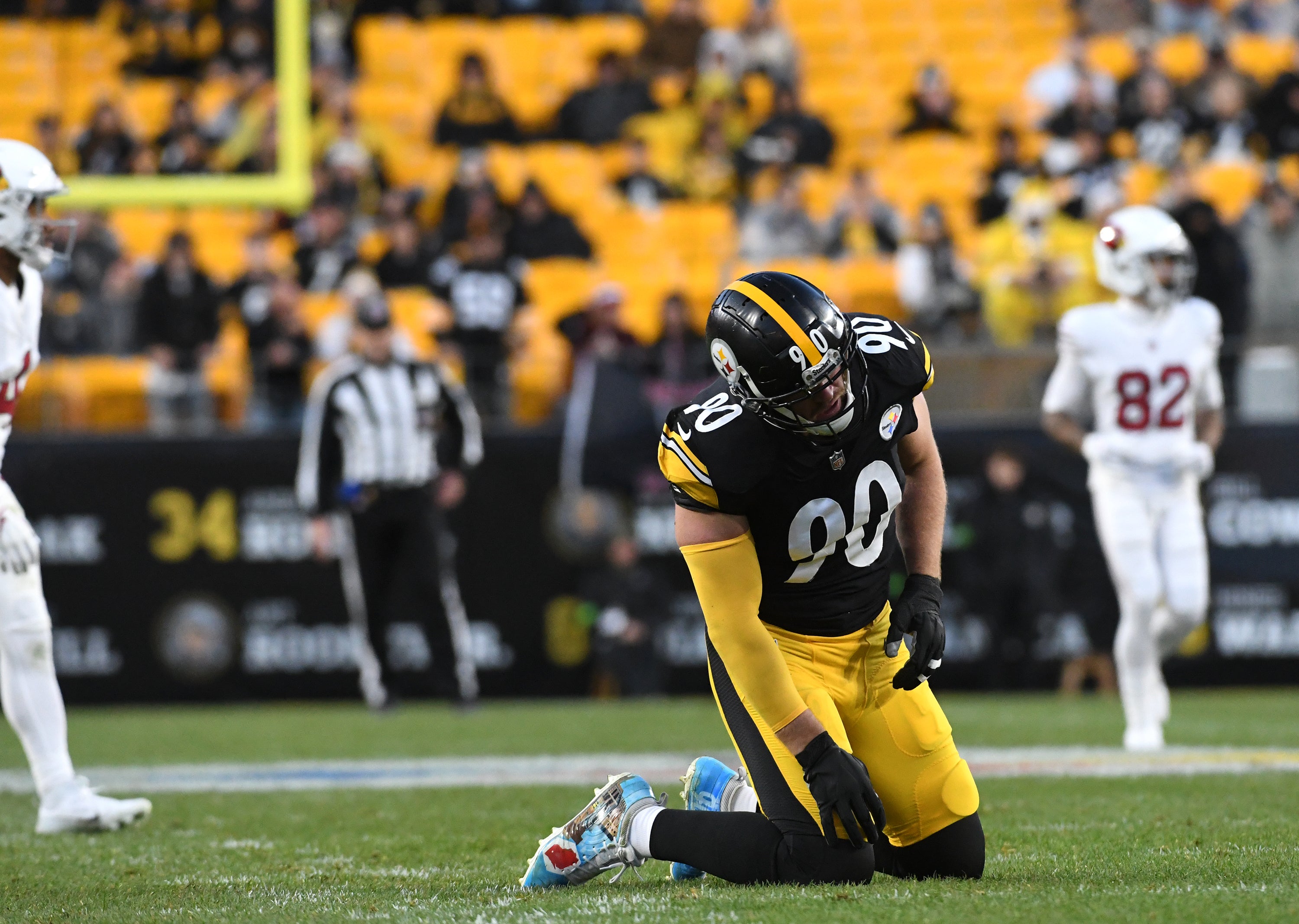 Dec 3, 2023; Pittsburgh, Pennsylvania, USA; Pittsburgh Steelers linebacker T.J. Watt (90) is slow getting up after a play against the Arizona Cardinals during the third quarter at Acrisure Stadium. Mandatory Credit: Philip G. Pavely-USA TODAY Sports