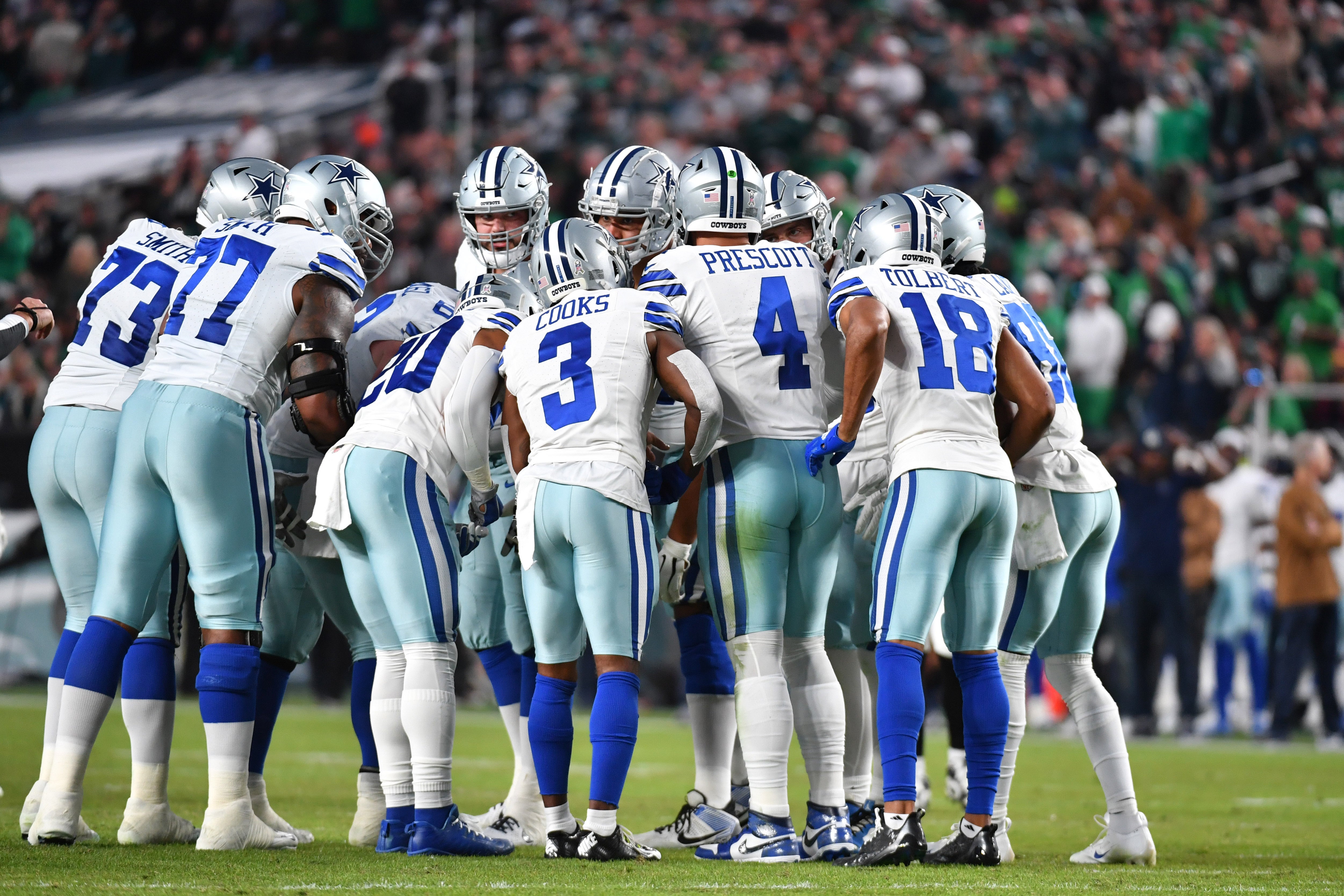 Dallas Cowboys quarterback Dak Prescott (4) leads his team in the huddle against the Philadelphia Eagles at Lincoln Financial Field.