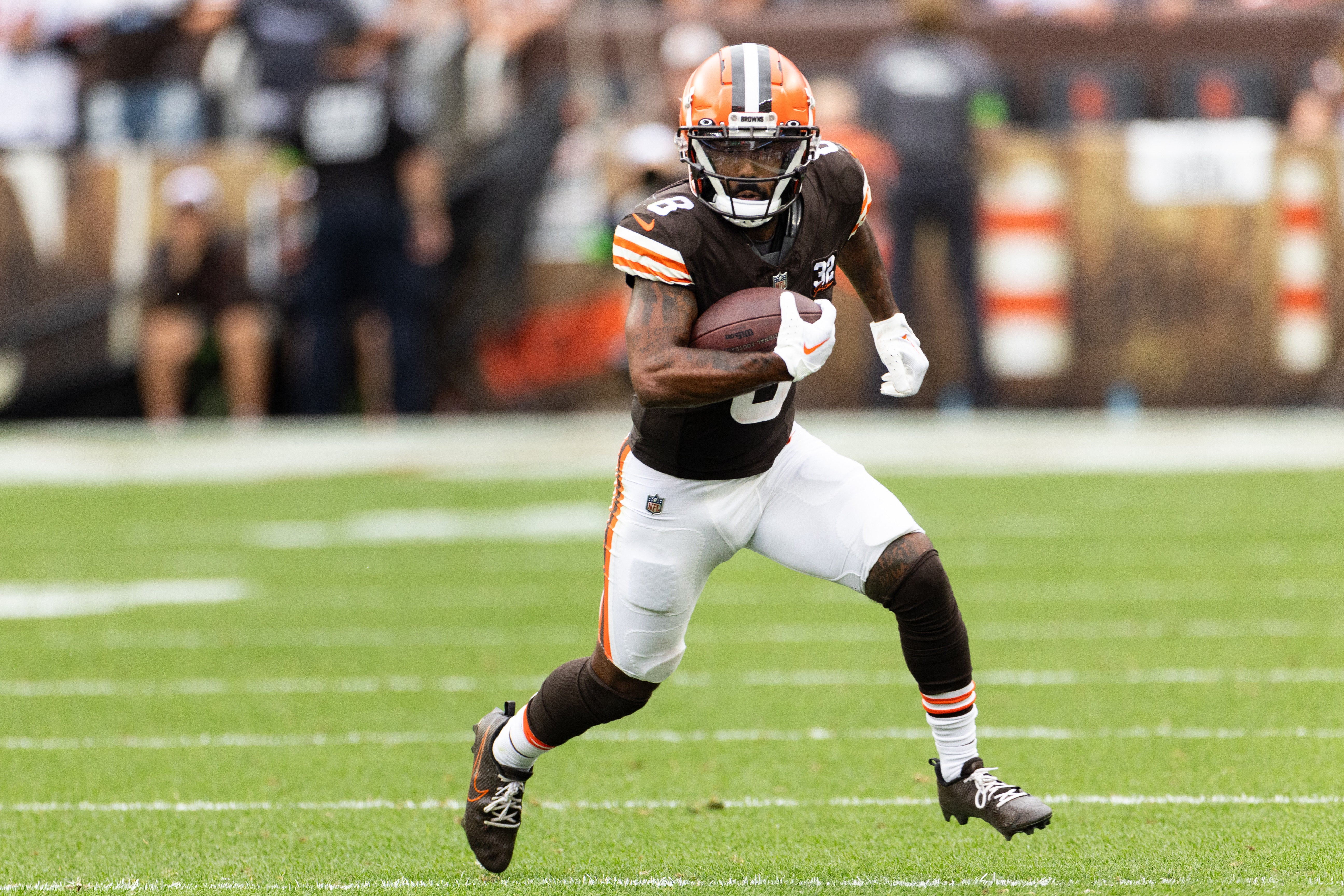 Sep 24, 2023; Cleveland, Ohio, USA; Cleveland Browns wide receiver Elijah Moore (8) runs the ball during the third quarter against the Tennessee Titans at Cleveland Browns Stadium. Mandatory Credit: Scott Galvin-USA TODAY Sports