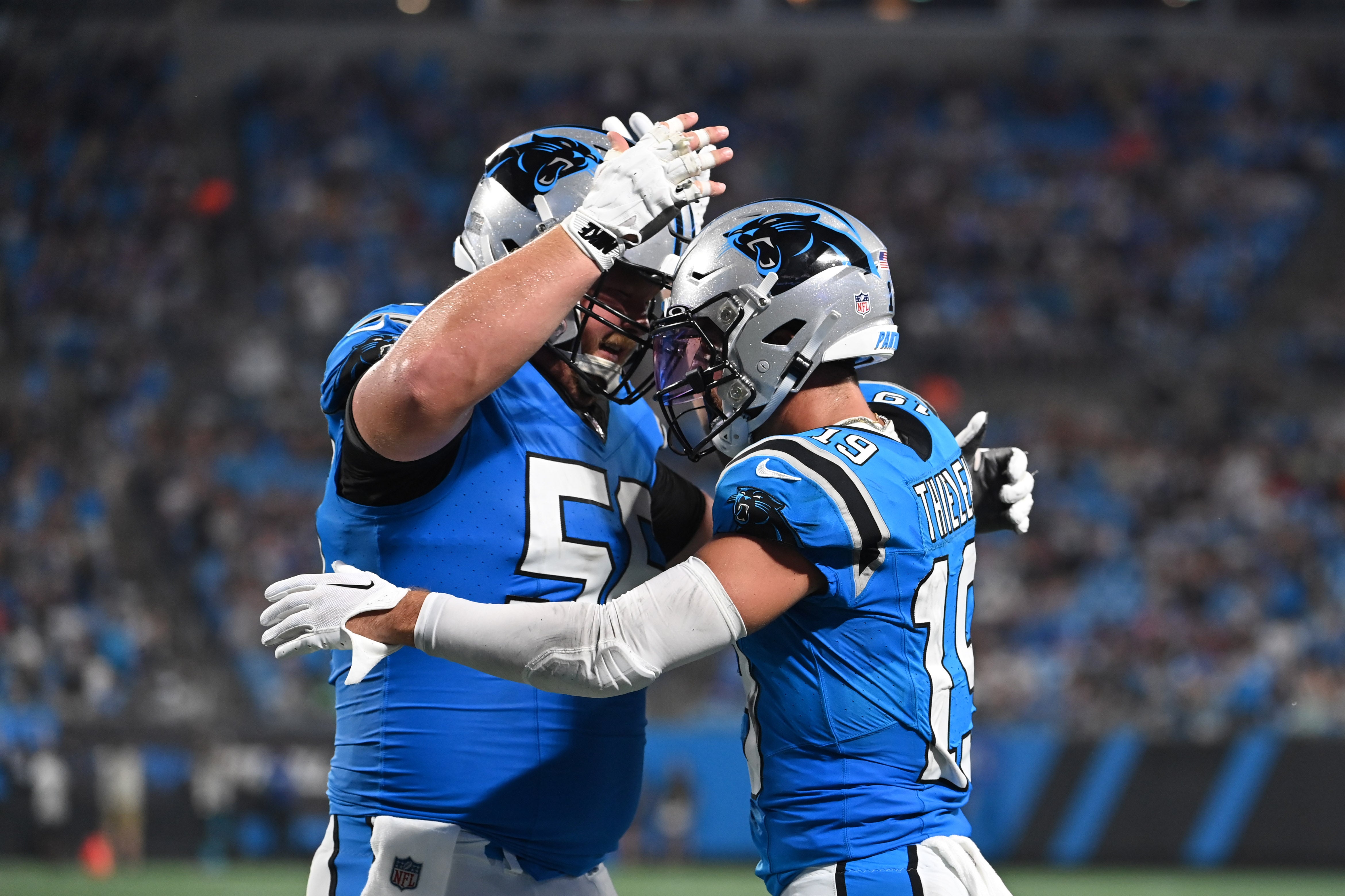 Aug 25, 2023; Charlotte, North Carolina, USA; Carolina Panthers wide receiver Adam Thielen (19) celebrates with center Bradley Bozeman (56) after scoring a touchdown in the first quarter at Bank of America Stadium. Mandatory Credit: Bob Donnan-USA TODAY Sports