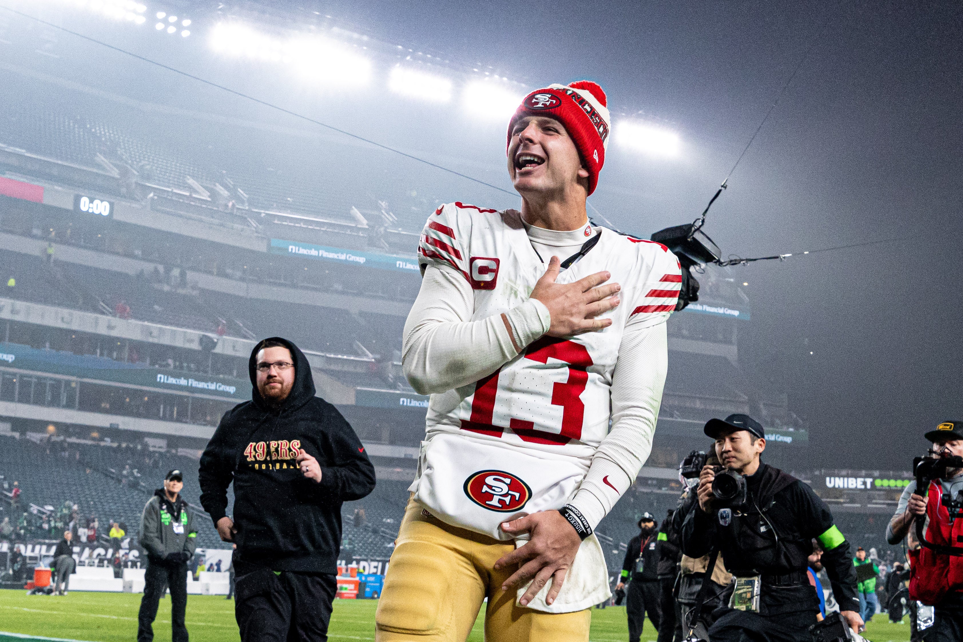 Dec 3, 2023; Philadelphia, Pennsylvania, USA; San Francisco 49ers quarterback Brock Purdy (13) celebrates as he walks off the field after a victory against the Philadelphia Eagles at Lincoln Financial Field.