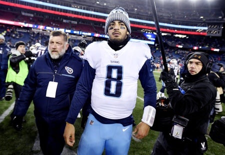 Tennessee Titans quarterback Marcus Mariota (8) walks off the field after their 35-14 loss to the New England Patriots in the AFC Divisional Round playoff game at Gillette Stadium in Foxborough, Mass.