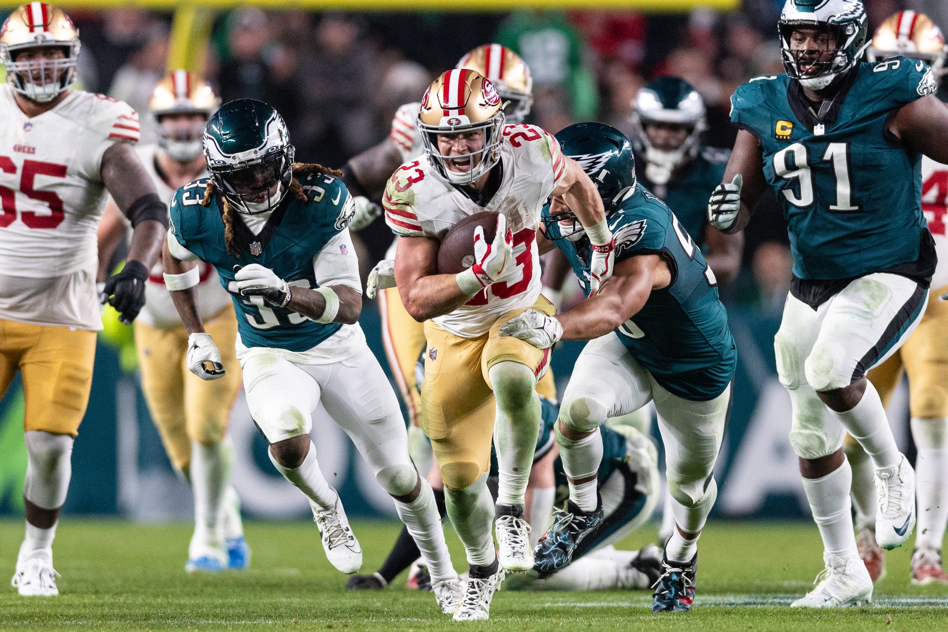 Dec 3, 2023; Philadelphia, Pennsylvania, USA; San Francisco 49ers running back Christian McCaffrey (23) runs with the ball against the Philadelphia Eagles during the third quarter at Lincoln Financial Field.