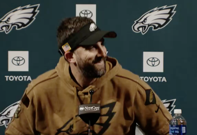 Philadelphia Eagles head coach Nick Sirianni talks "Run the Ball" sign during Wednesday's press conference.