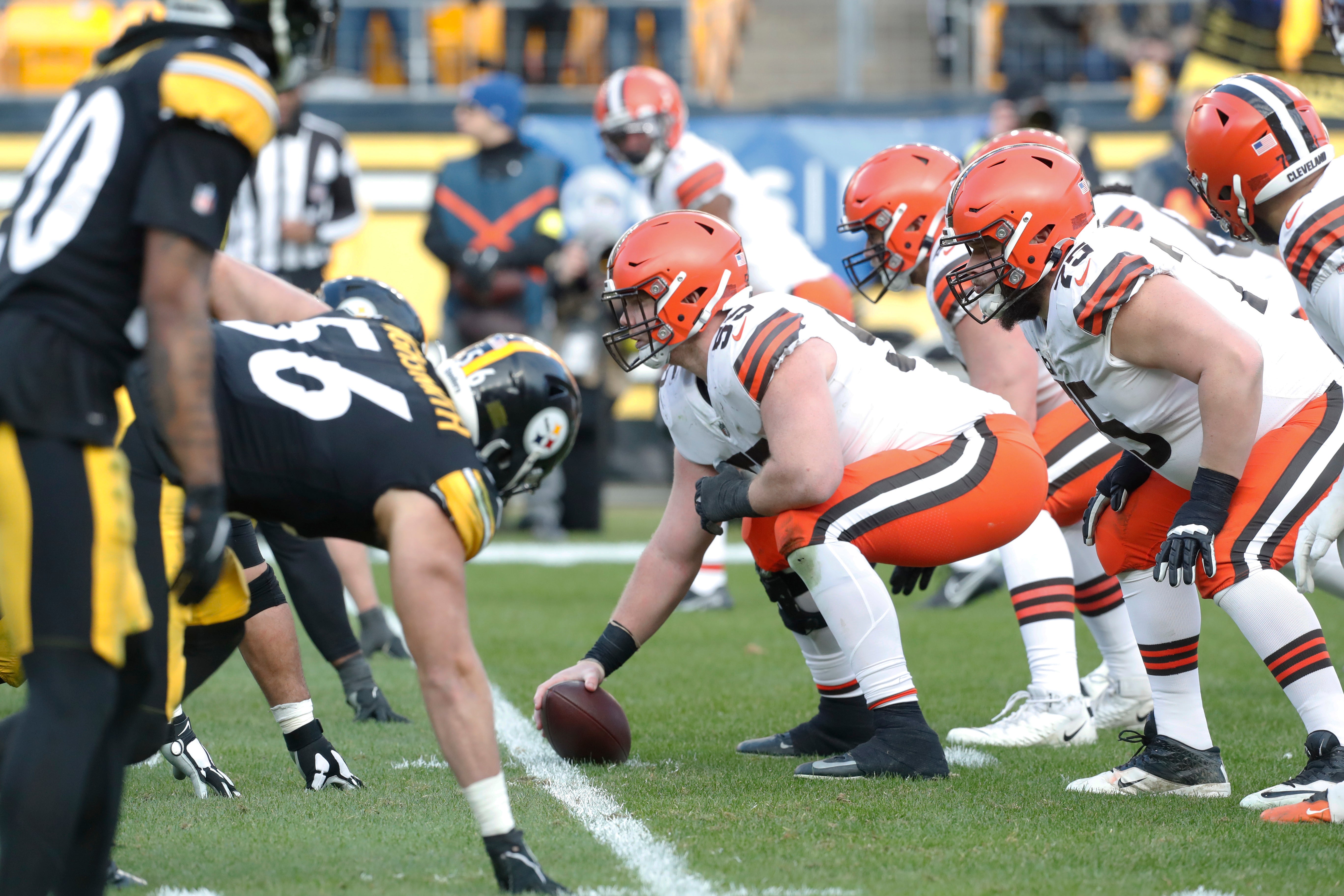 Jan 8, 2023; Pittsburgh, Pennsylvania, USA; Cleveland Browns center Ethan Pocic (55) prepares to snap the ball against the Pittsburgh Steelers during the fourth quarter at Acrisure Stadium. Pittsburgh won 28-14.