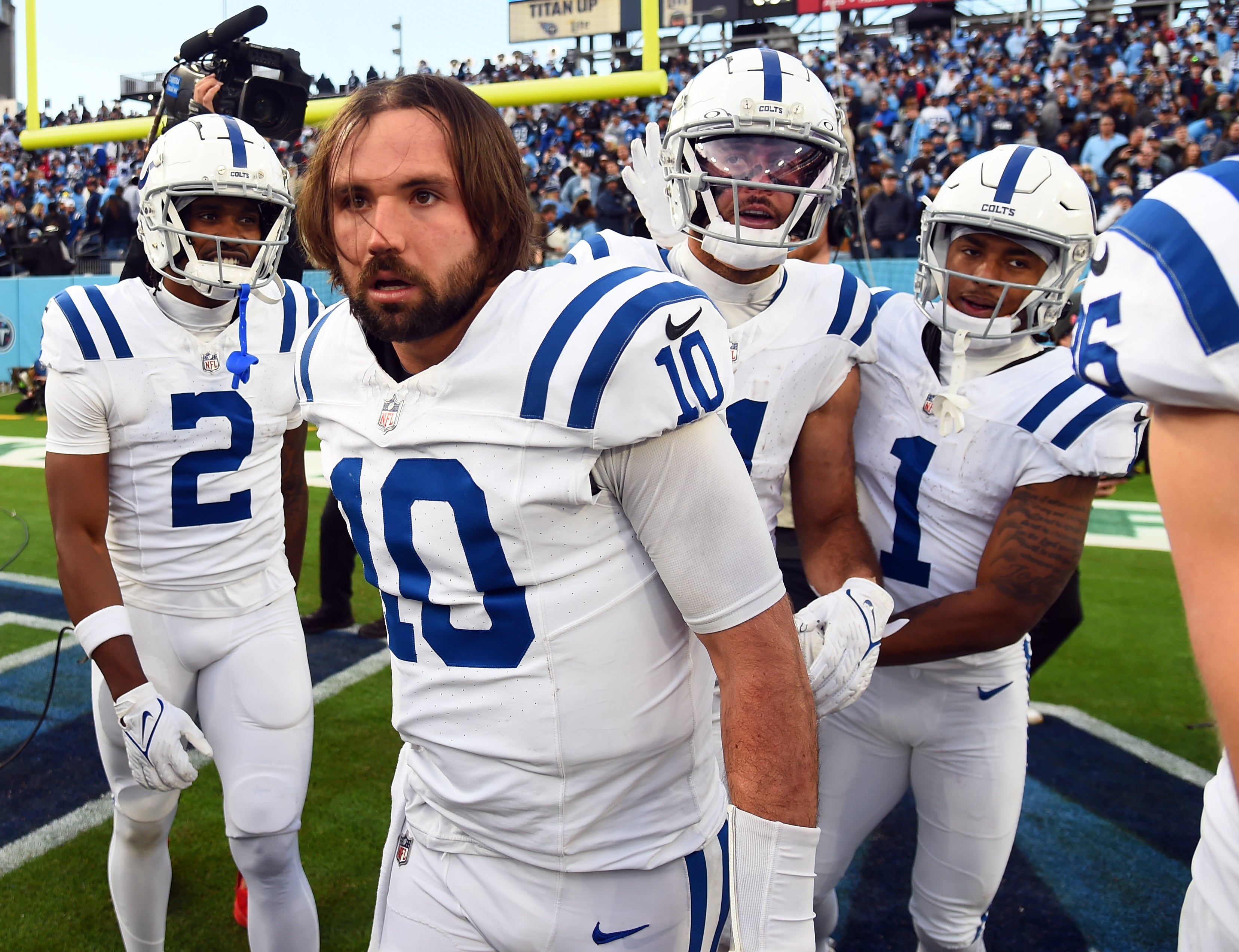 Dec 3, 2023; Nashville, Tennessee, USA; Indianapolis Colts quarterback Gardner Minshew (10) celebrates with teammates after throwing the game-winning touchdown in overtime against the Tennessee Titans at Nissan Stadium.