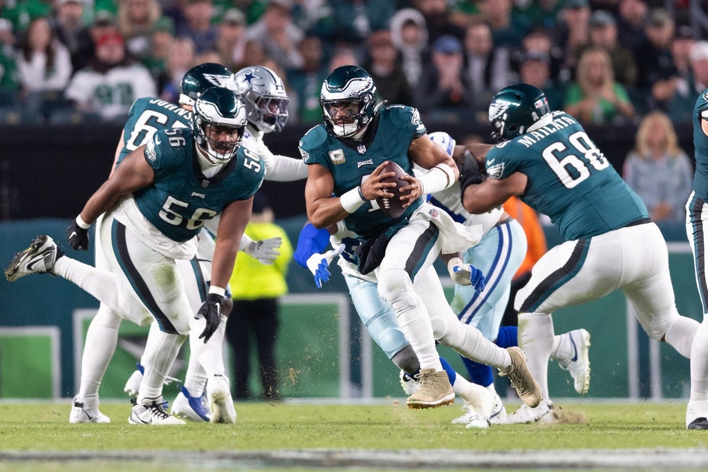 Philadelphia Eagles quarterback Jalen Hurts runs with the ball against the Dallas Cowboys during the second quarter at Lincoln Financial Field.