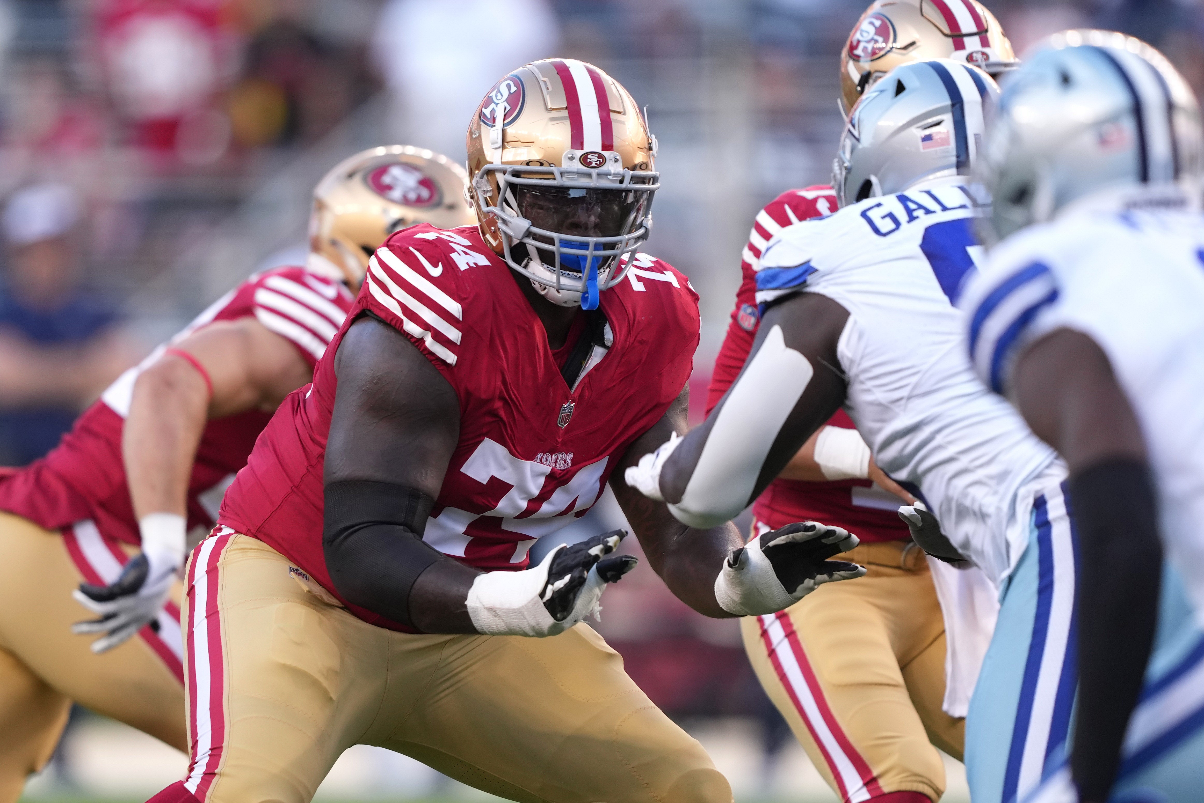 Oct 8, 2023; Santa Clara, California, USA; San Francisco 49ers offensive tackle Spencer Burford (74) blocks Dallas Cowboys defensive tackle Neville Gallimore (96) during the first quarter at Levi's Stadium.