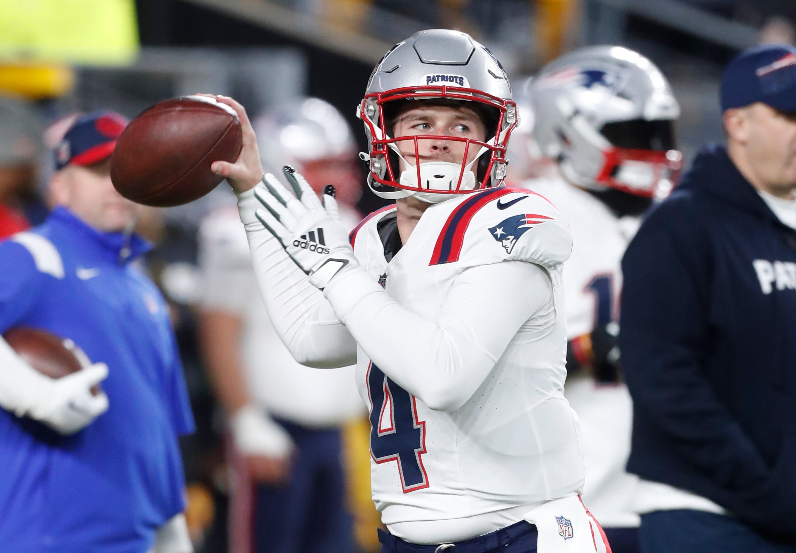 New England Patriots quarterback Bailey Zappe warms up before the game against the Pittsburgh Steelers at Acrisure Stadium.