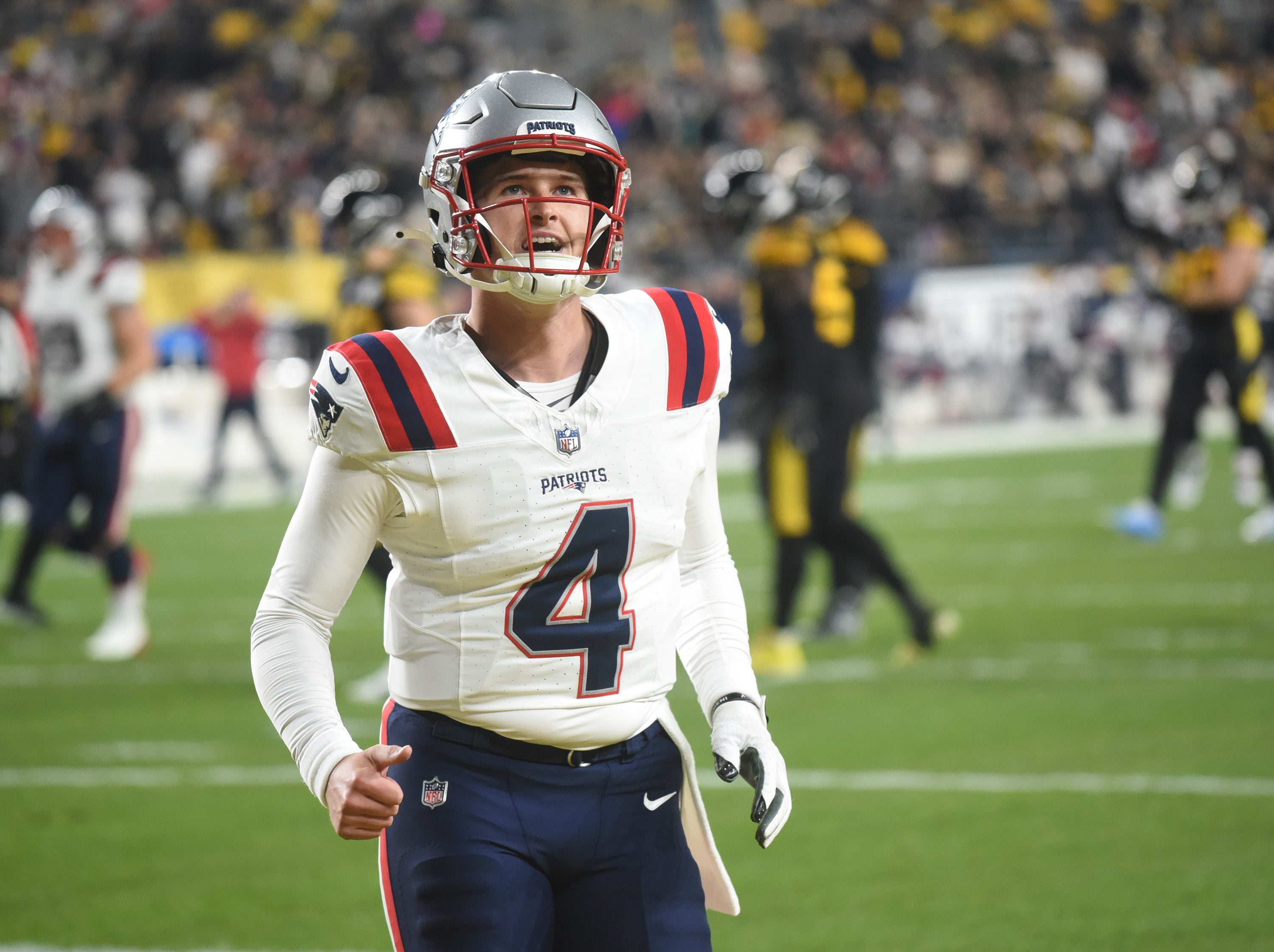 New England Patriots quarterback Bailey Zappe reacts after a touchdown against the Pittsburgh Steelers during the second quarter at Acrisure Stadium.