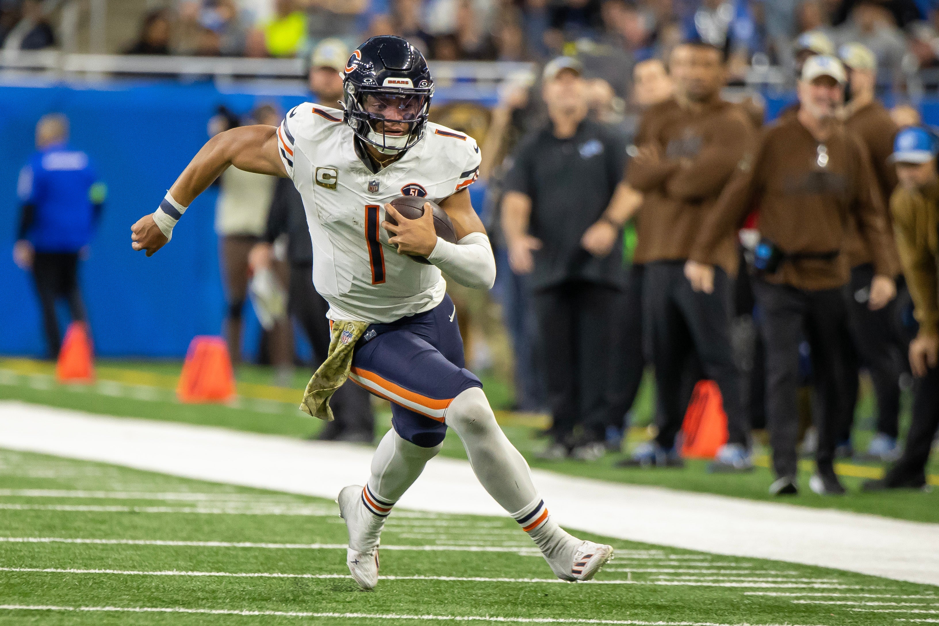 Nov 19, 2023; Detroit, Michigan, USA; Chicago Bears quarterback Justin Fields (1) runs with the ball against the Detroit Lions during the second half at Ford Field.