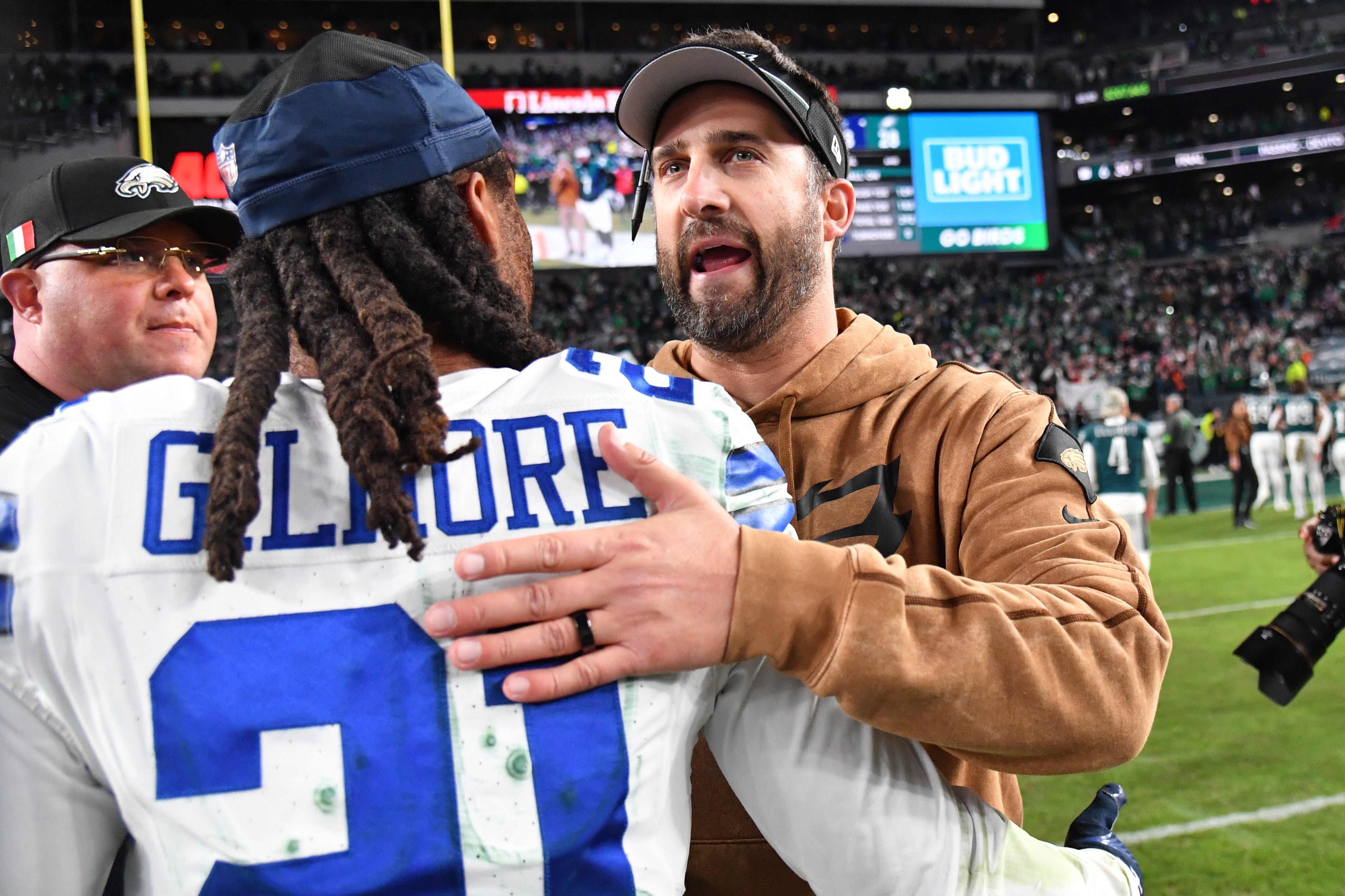 Philadelphia Eagles head coach Nick Sirianni meets with Dallas Cowboys cornerback Stephon Gilmore (21) after Eagles win at Lincoln Financial Field.