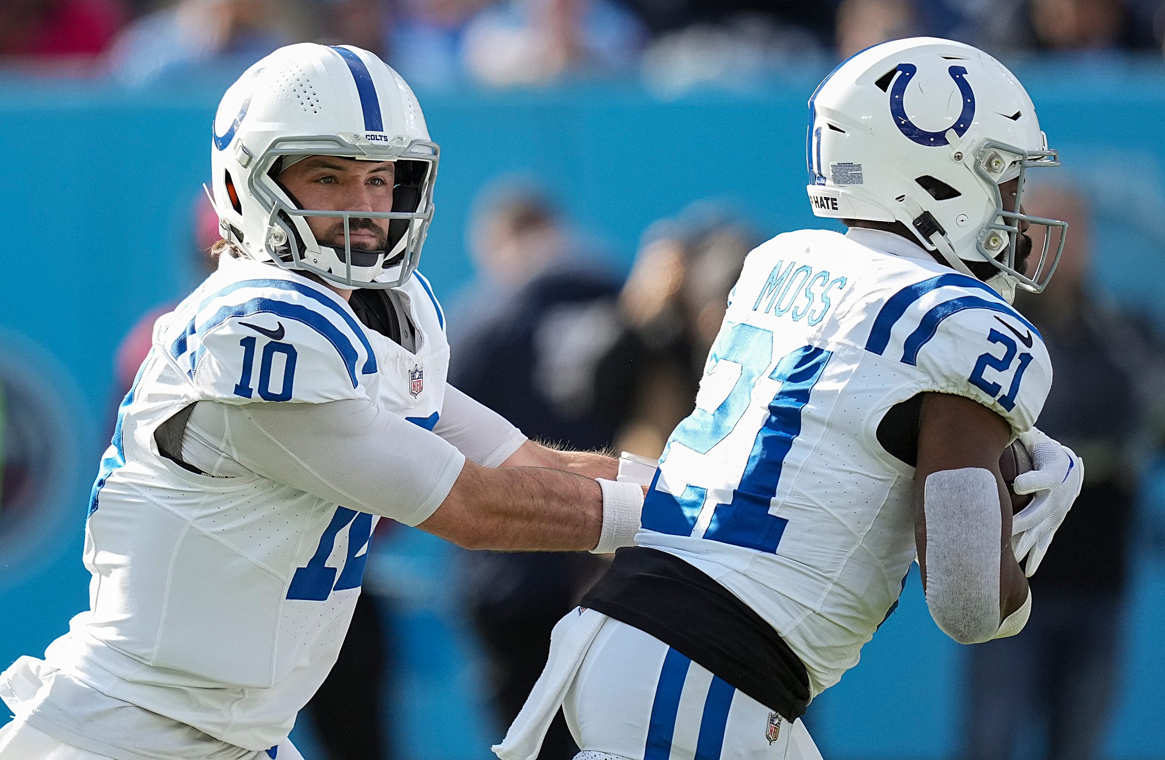Indianapolis Colts quarterback Gardner Minshew II (10) hands the ball off to running back Zack Moss (21) on Sunday, Dec. 3, 2023, during a game against the Tennessee Titans at Nissan Stadium in Nashville, Tenn.