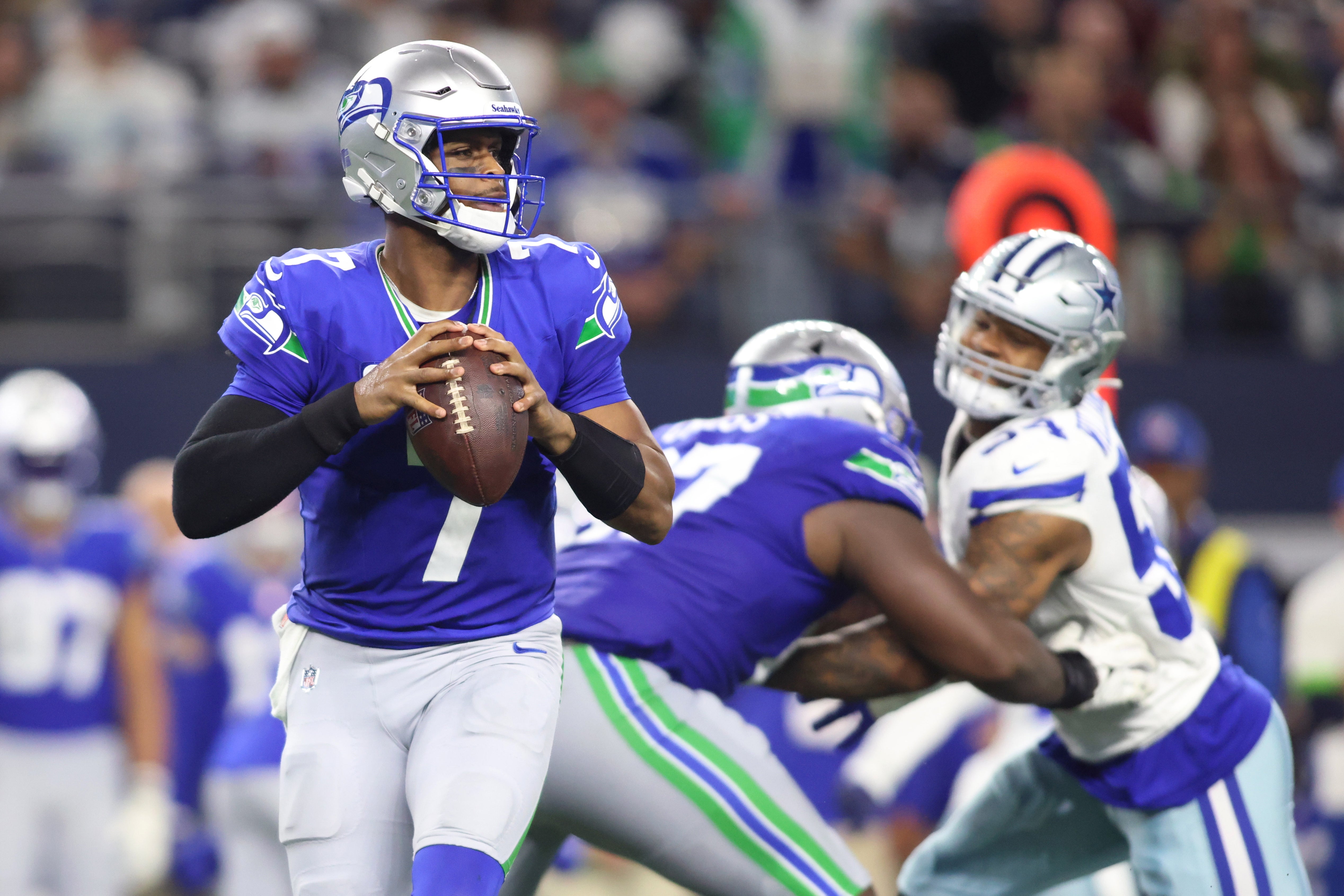 Nov 30, 2023; Arlington, Texas, USA; Seattle Seahawks quarterback Geno Smith (7) looks to pass against the Dallas Cowboys during the second half at AT&T Stadium.