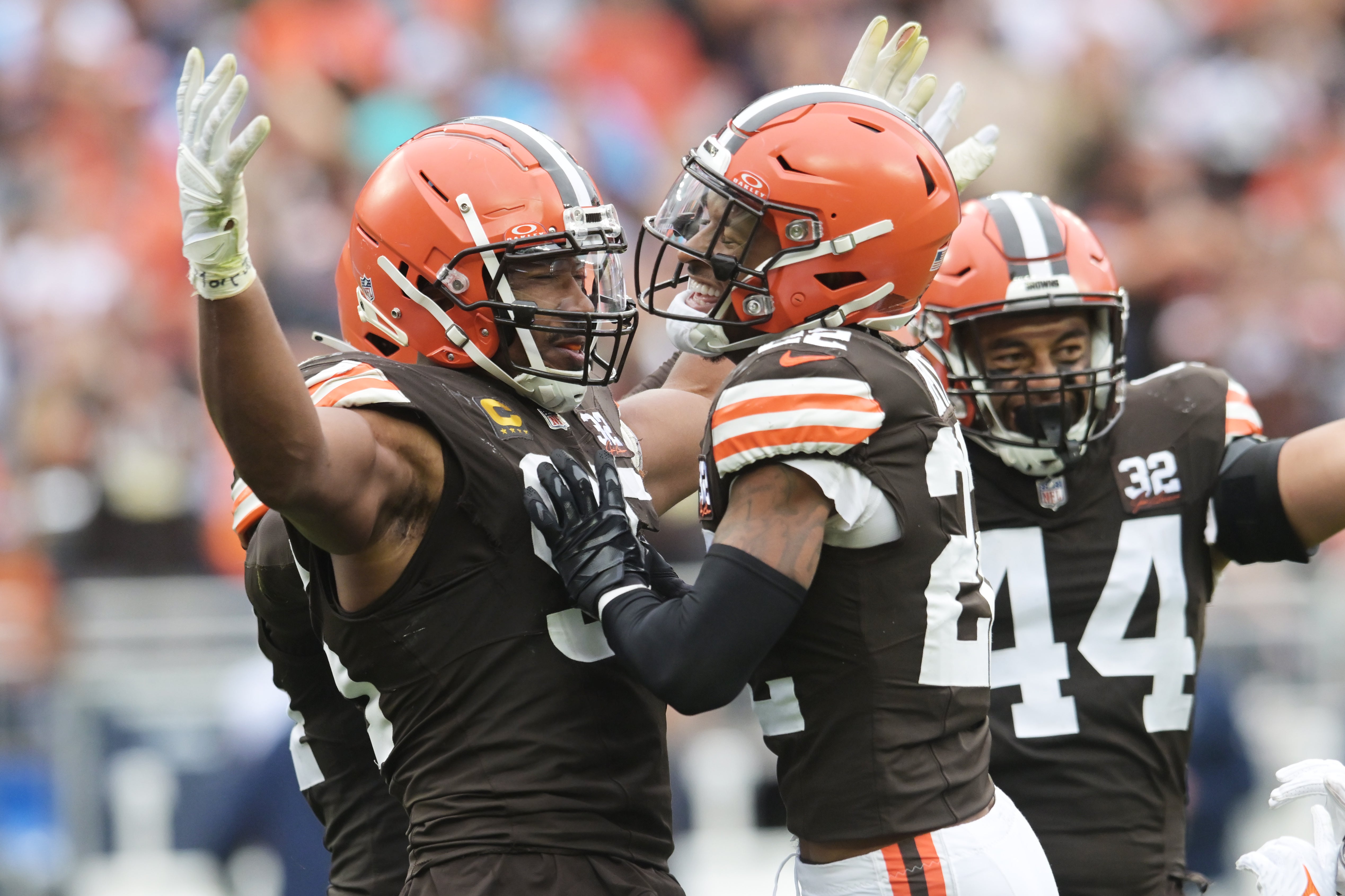 Sep 24, 2023; Cleveland, Ohio, USA; Cleveland Browns defensive end Myles Garrett (95) and safety Grant Delpit (22) and linebacker Sione Takitaki (44) celebrate after sacking Tennessee Titans quarterback Ryan Tannehill (not pictured) during the second half at Cleveland Browns Stadium. Mandatory Credit: Ken Blaze-USA TODAY Sports
