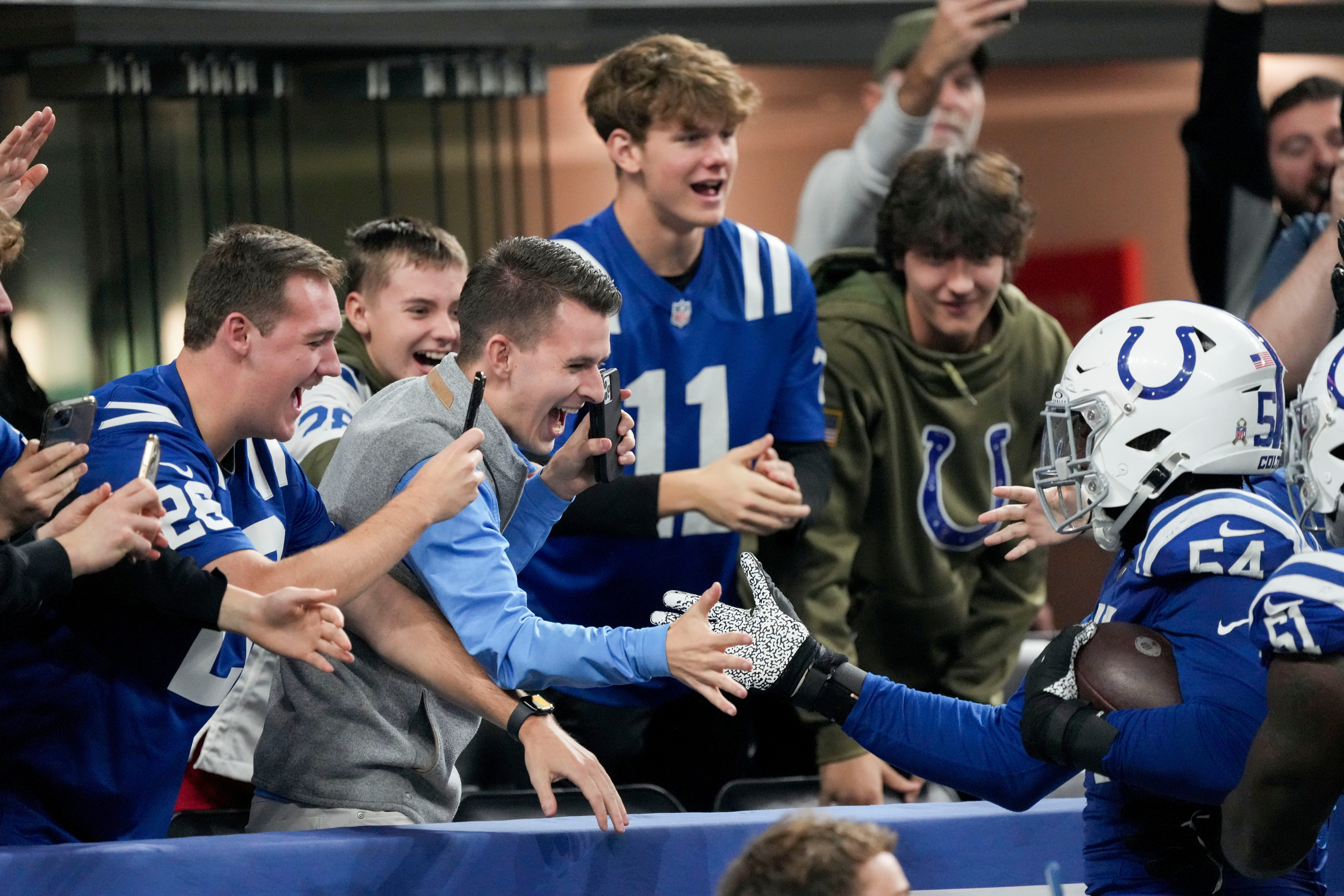 Indianapolis Colts defensive end Dayo Odeyingbo (54) celebrates with fans Sunday, Nov. 26, 2023, during a game against the Tampa Bay Buccaneers at Lucas Oil Stadium in Indianapolis.