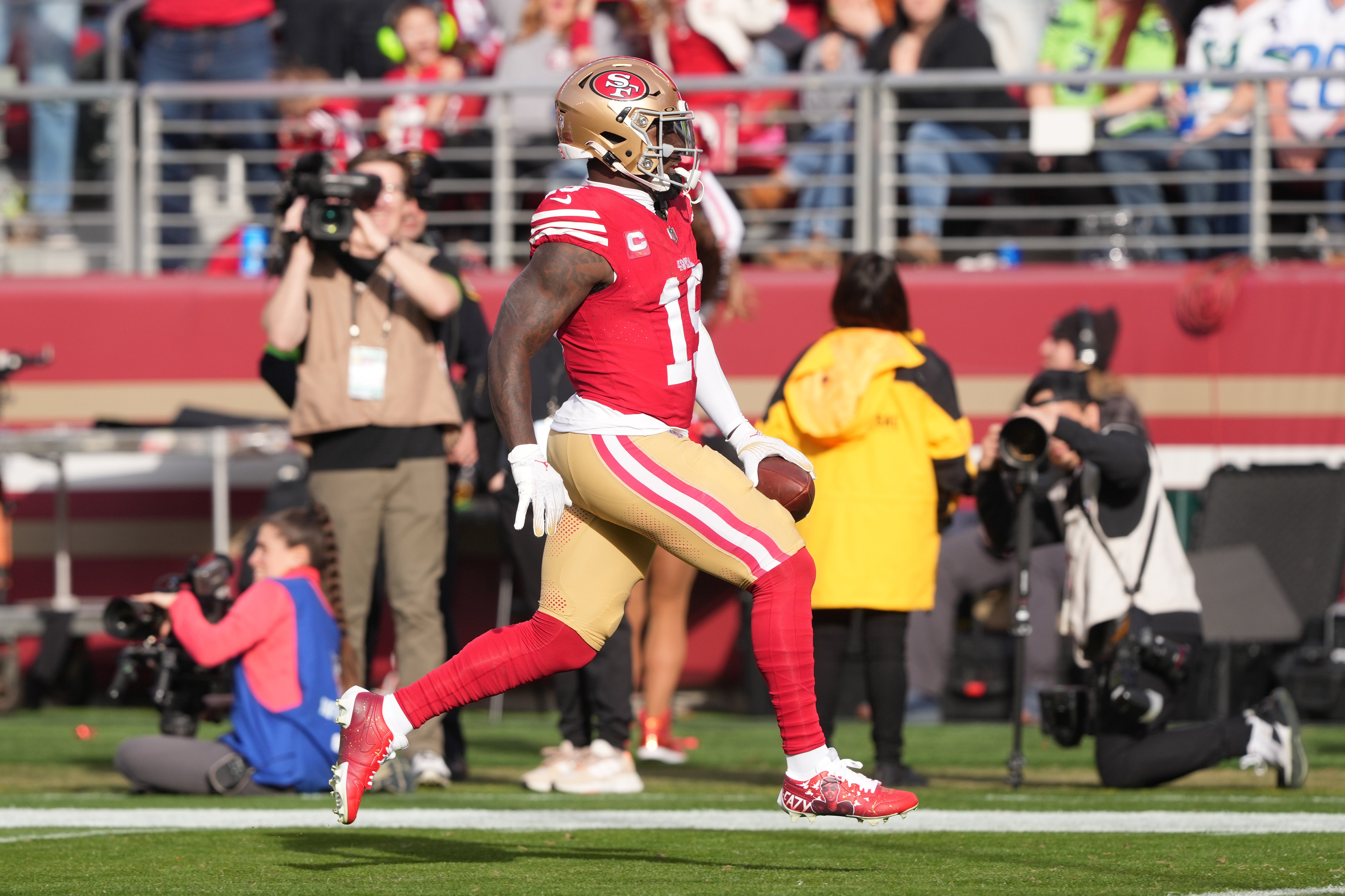 Dec 10, 2023; Santa Clara, California, USA; San Francisco 49ers wide receiver Deebo Samuel (19) runs into the end zone to score a touchdown against the Seattle Seahawks during the second quarter at Levi's Stadium.