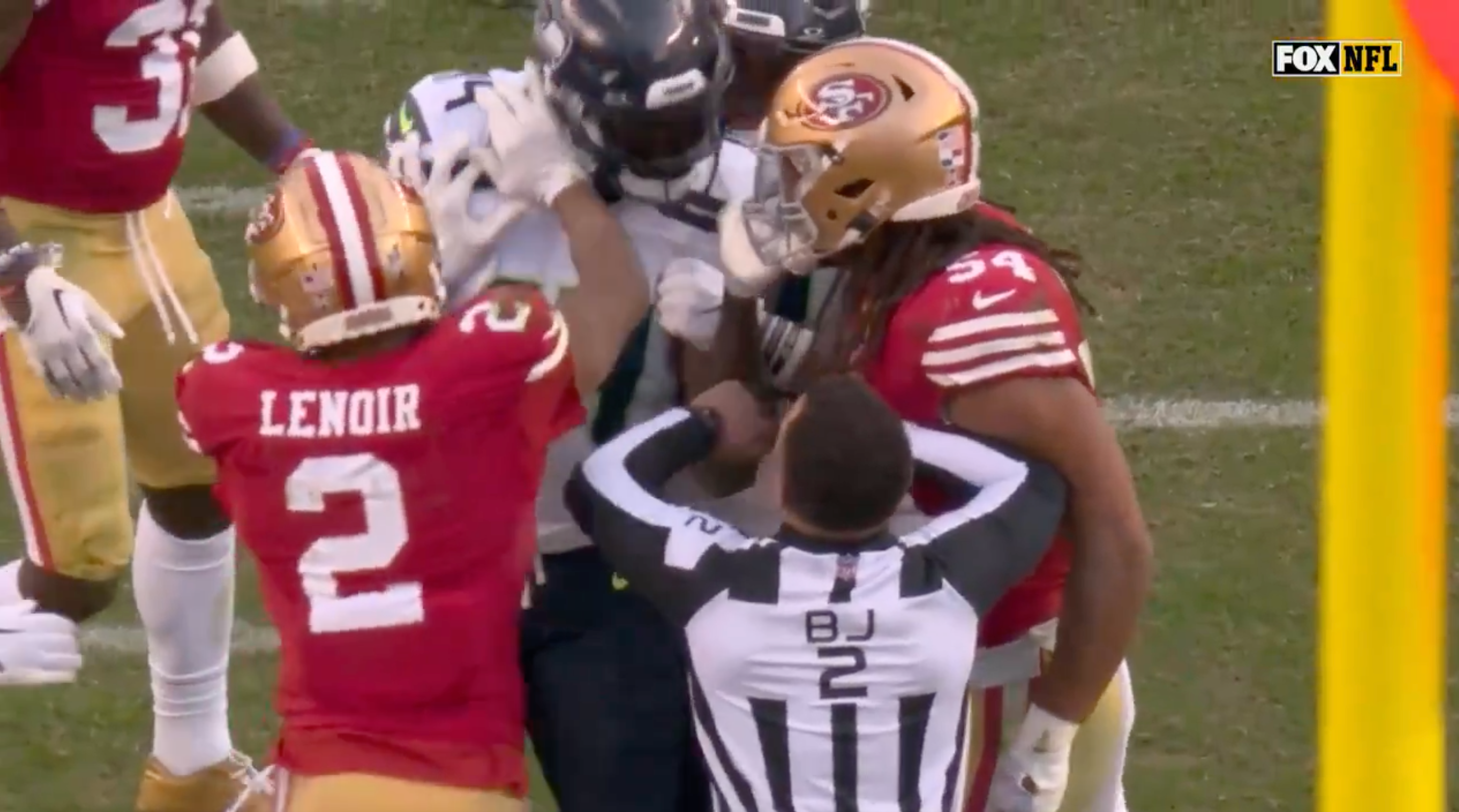 Deommodore Lenoir shoves DK Metcalf during the 49ers' win over the Seahawks.