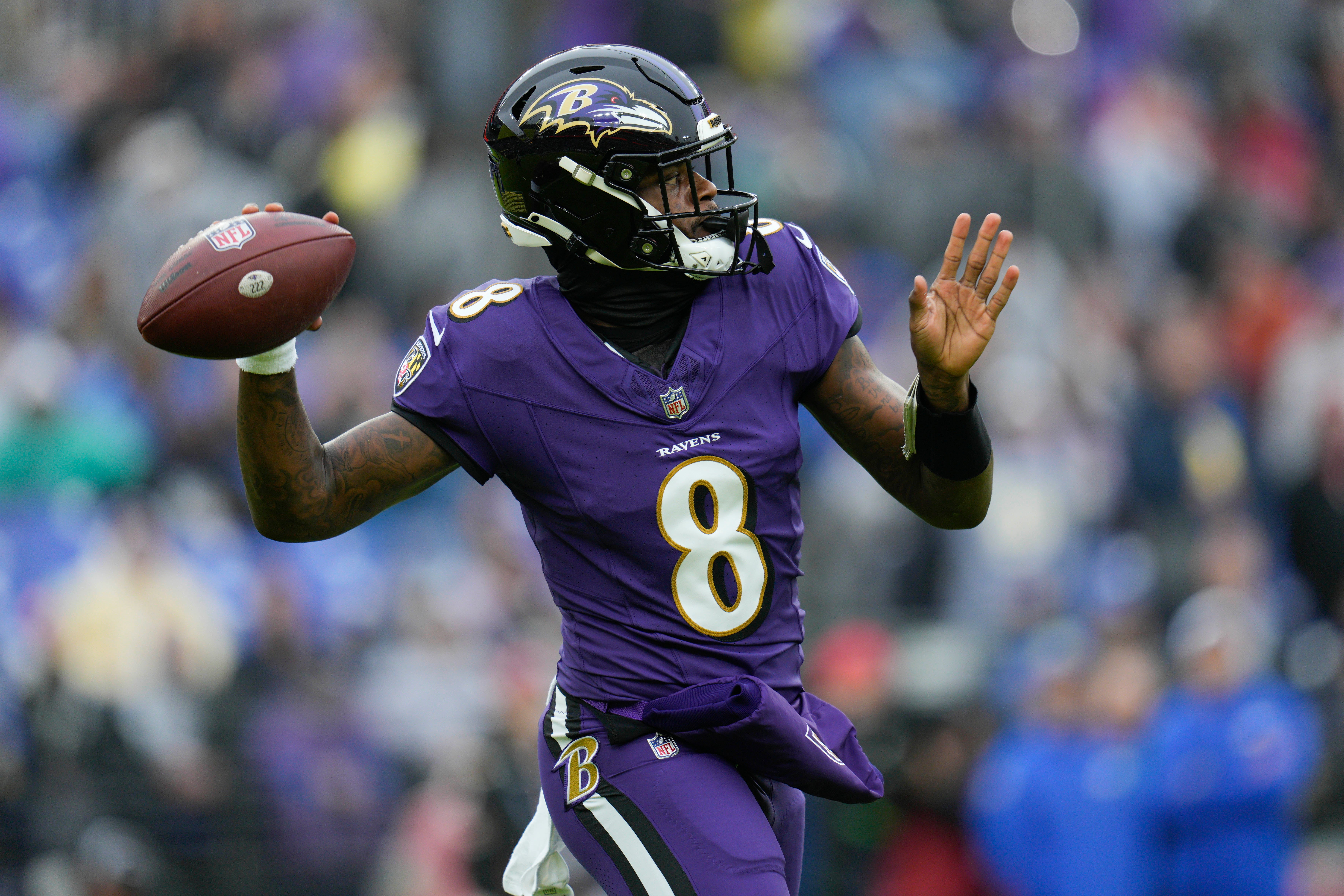 Baltimore Ravens quarterback Lamar Jackson (8) passes during the first quarter against the Los Angeles Rams at M&T Bank Stadium.