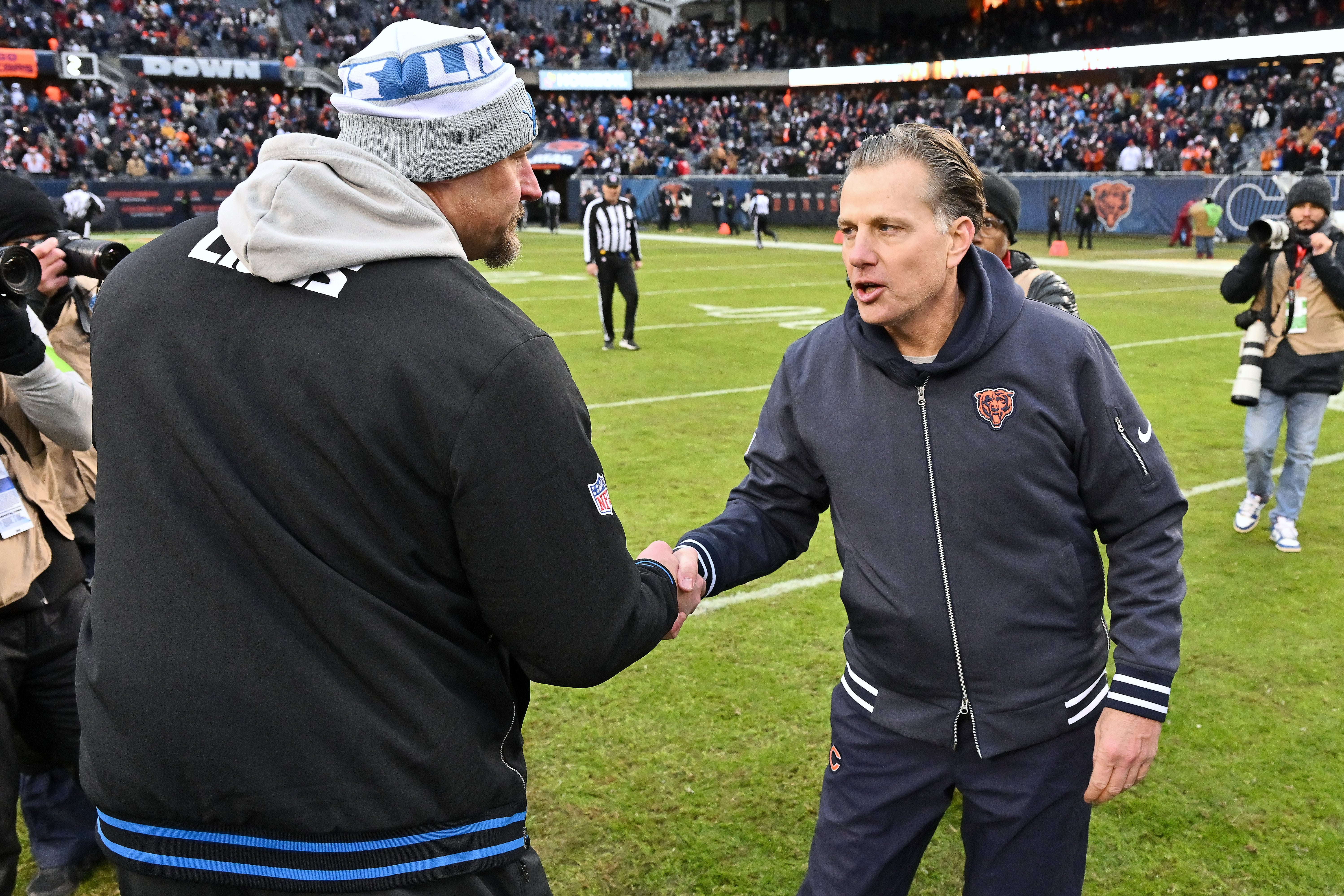 Dec 10, 2023; Chicago, Illinois, USA; Detroit Lions head coach Dan Campbell, left, shakes hands with Chicago Bears head coach Matt Eberflus after Chicago defeated Detroit 28-13 at Soldier Field.
