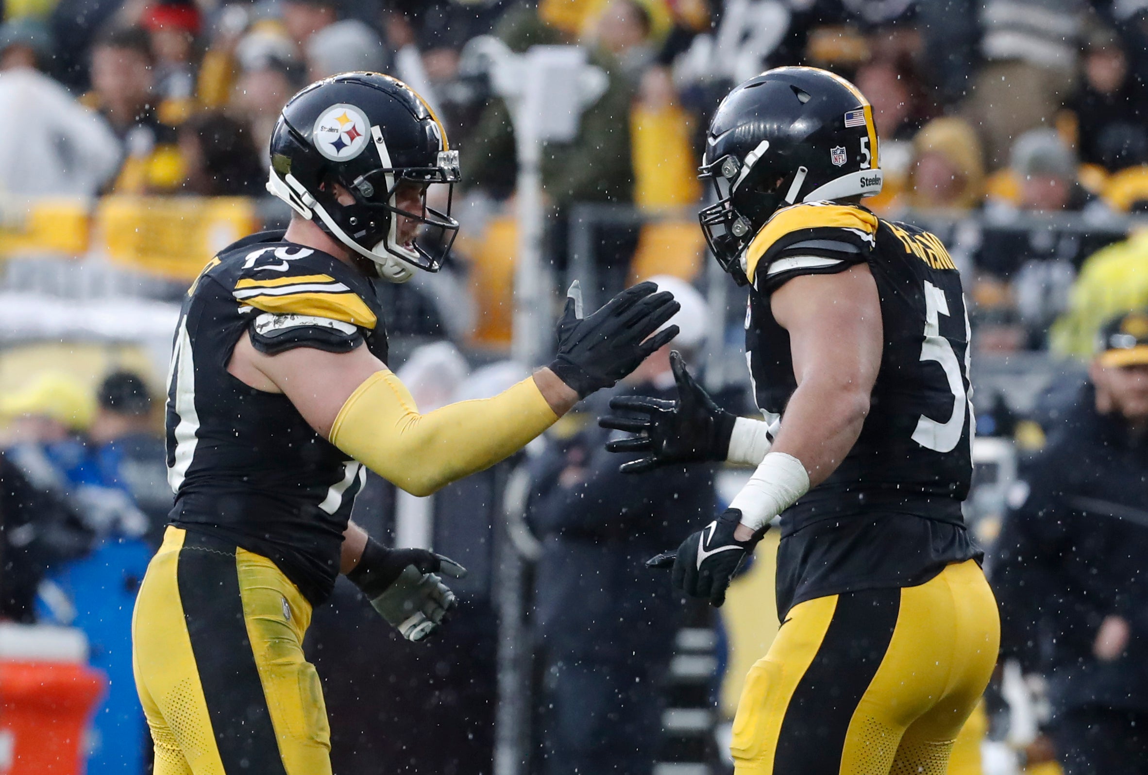 Dec 3, 2023; Pittsburgh, Pennsylvania, USA; Pittsburgh Steelers linebacker T.J. Watt (90) and linebacker Alex Highsmith (56) celebrate a sack by Watt against the Arizona Cardinals during the third quarter at Acrisure Stadium. Mandatory Credit: Charles LeClaire-USA TODAY Sports