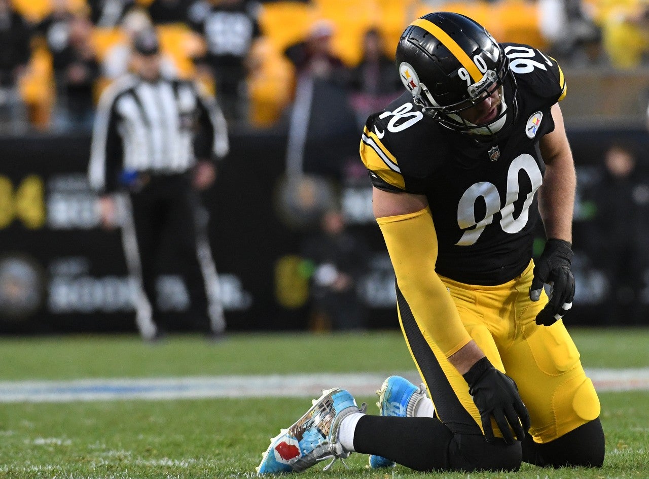 Dec 3, 2023; Pittsburgh, Pennsylvania, USA; Pittsburgh Steelers linebacker T.J. Watt (90) is slow getting up after a play against the Arizona Cardinals during the third quarter at Acrisure Stadium. Mandatory Credit: Philip G. Pavely-USA TODAY Sports  