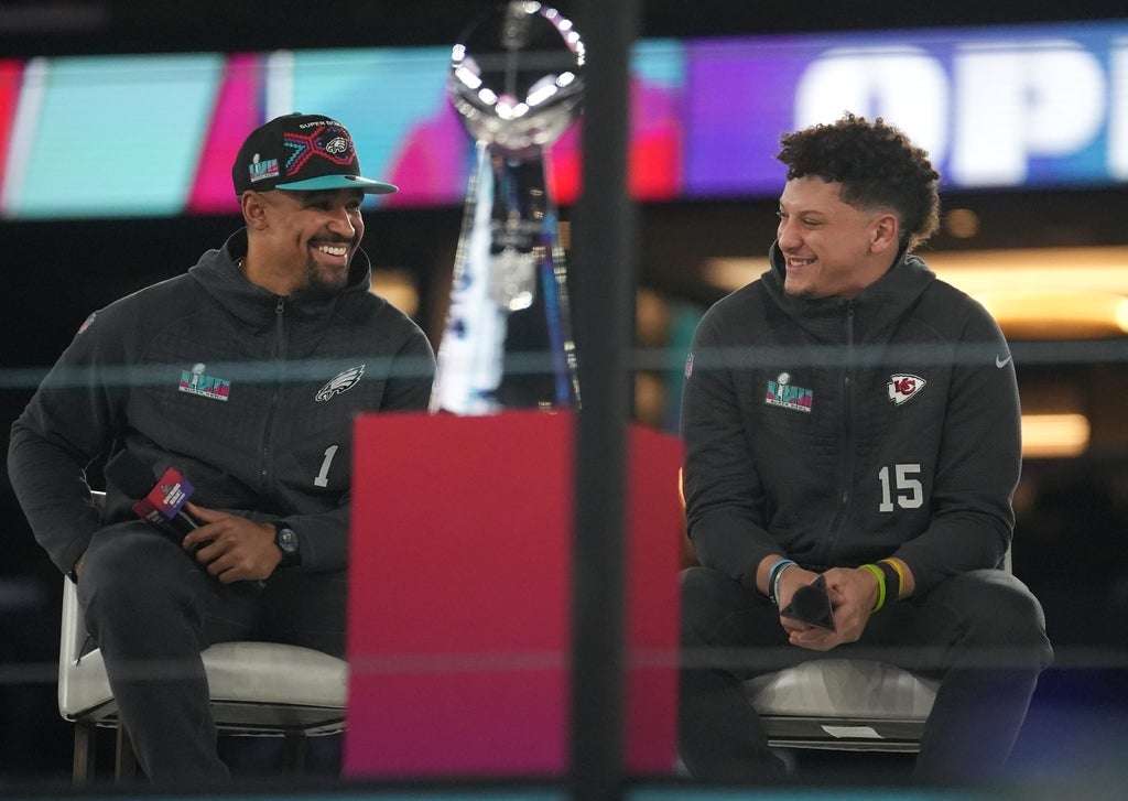 Kansas City Chiefs quarterback Patrick Mahomes, right, and Philadelphia Eagles quarterback Jalen Hurts, left, share the stage at the Footprint Center in downtown Phoenix during the NFL's Super Bowl LVII.
