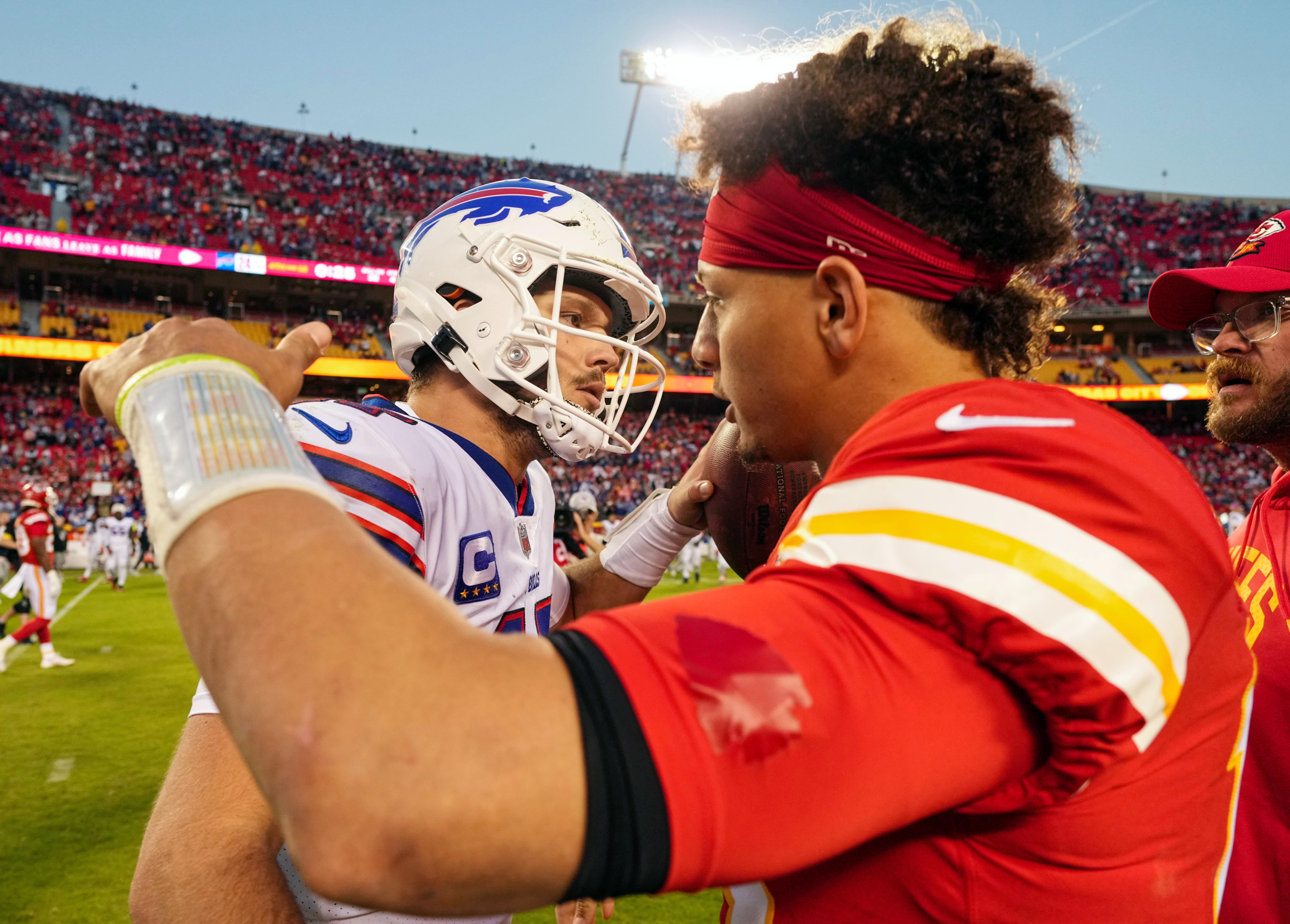 Buffalo Bills quarterback Josh Allen hugs Kansas City Chiefs quarterback Patrick Mahomes after a game at GEHA Field at Arrowhead Stadium