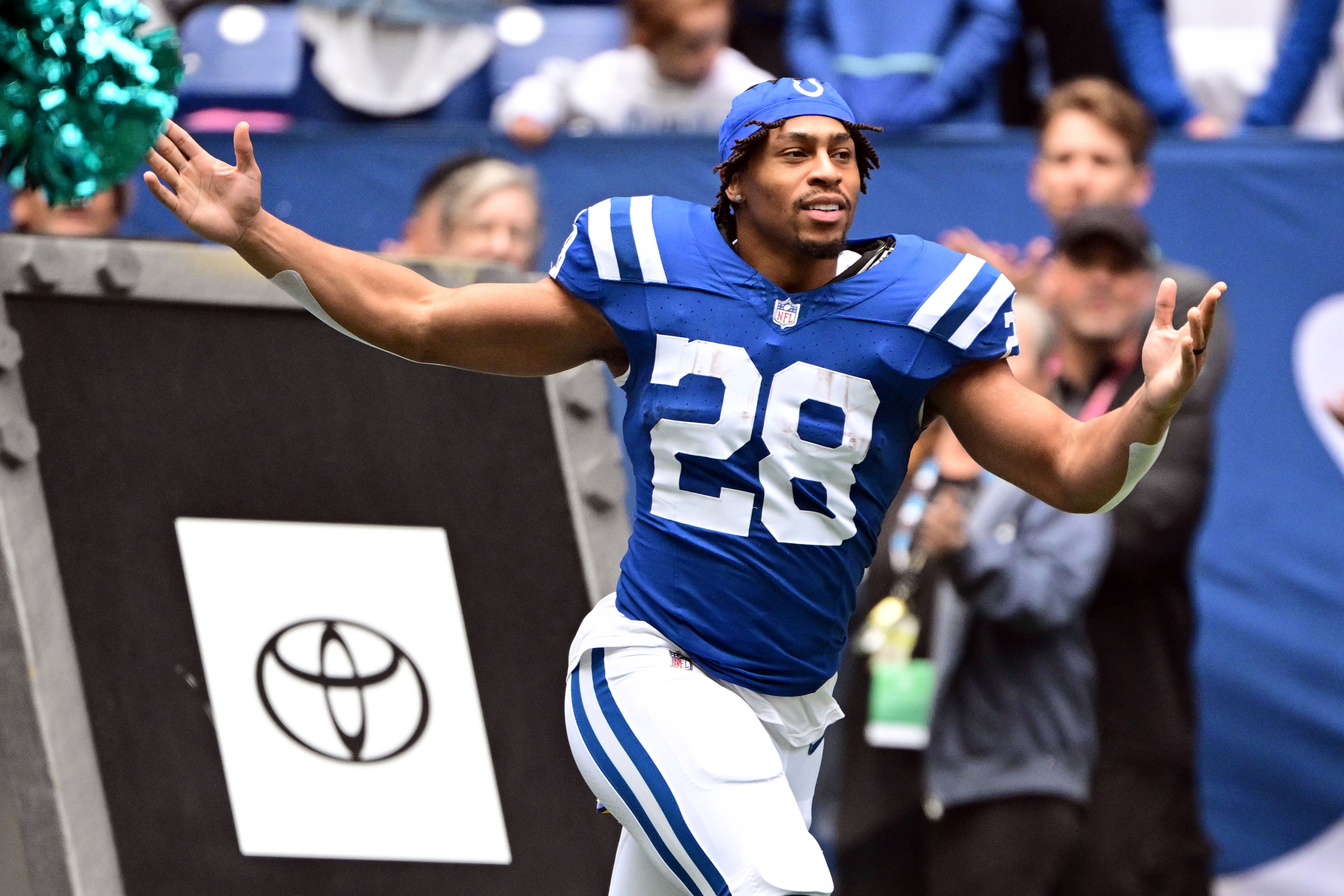 Oct 8, 2023; Indianapolis, Indiana, USA; Indianapolis Colts running back Jonathan Taylor (28) runs onto the field during player introductions before the game against the Tennessee Titans at Lucas Oil Stadium.