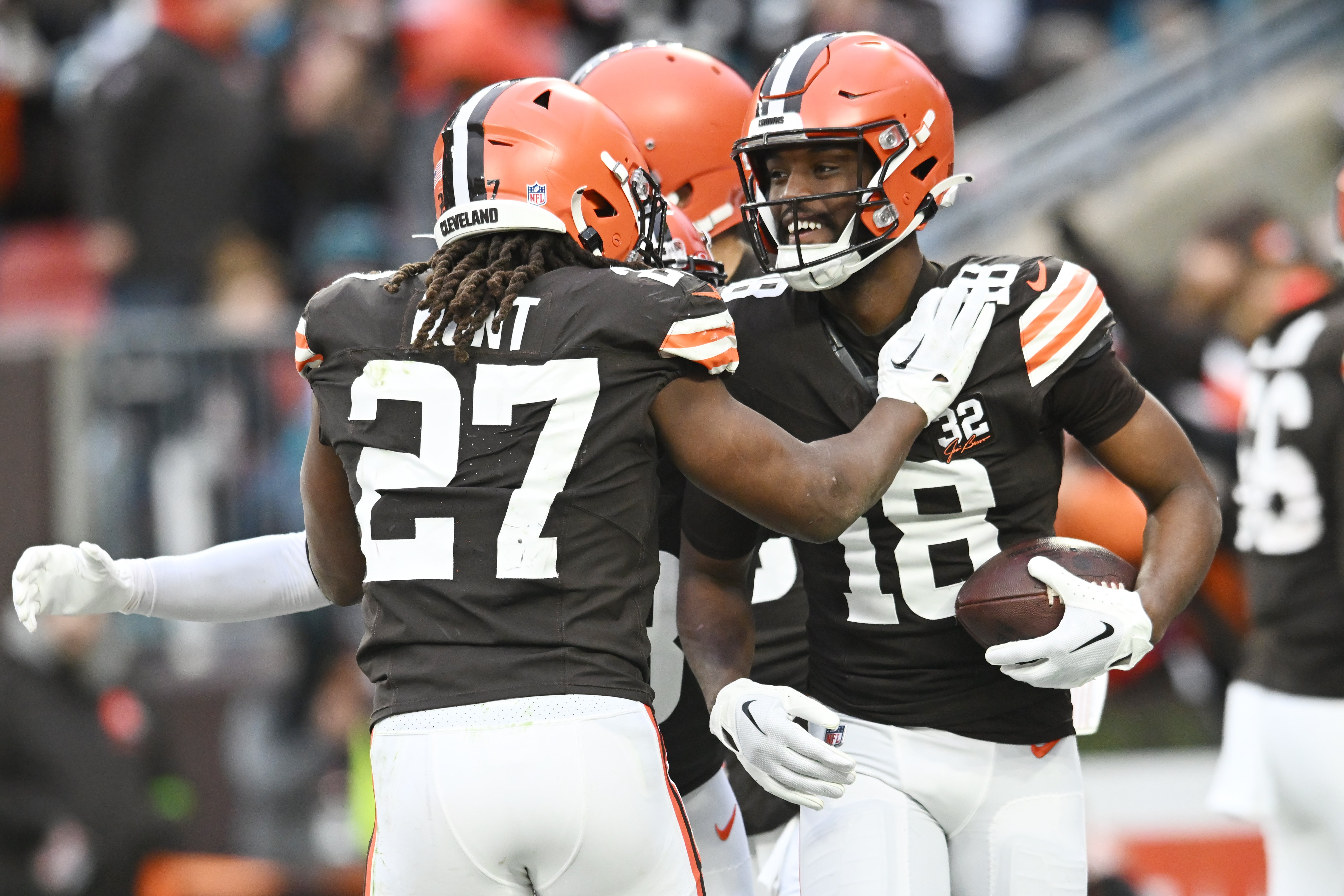 Dec 10, 2023; Cleveland, Ohio, USA; Cleveland Browns running back Kareem Hunt (27) and wide receiver David Bell (18) celebrate after Bell caught a touchdown pass during the second half against the Jacksonville Jaguars at Cleveland Browns Stadium. Mandatory Credit: Ken Blaze-USA TODAY Sports