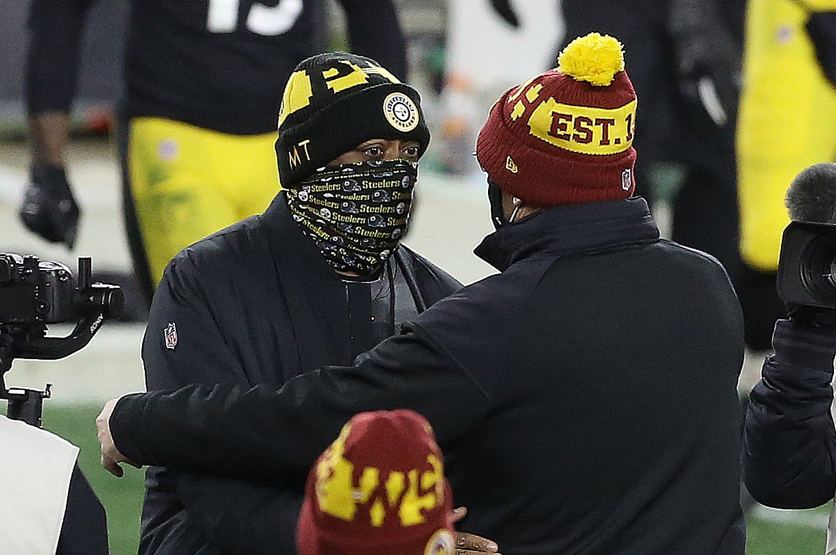 Dec 7, 2020; Pittsburgh, Pennsylvania, USA; Pittsburgh Steelers head coach Mike Tomlin(left) and Washington Football Team head coach Ron Rivera (right) free each other at mid-field after their game at Heinz Field. Washington won 23-17. Mandatory Credit: Charles LeClaire-USA TODAY Sports