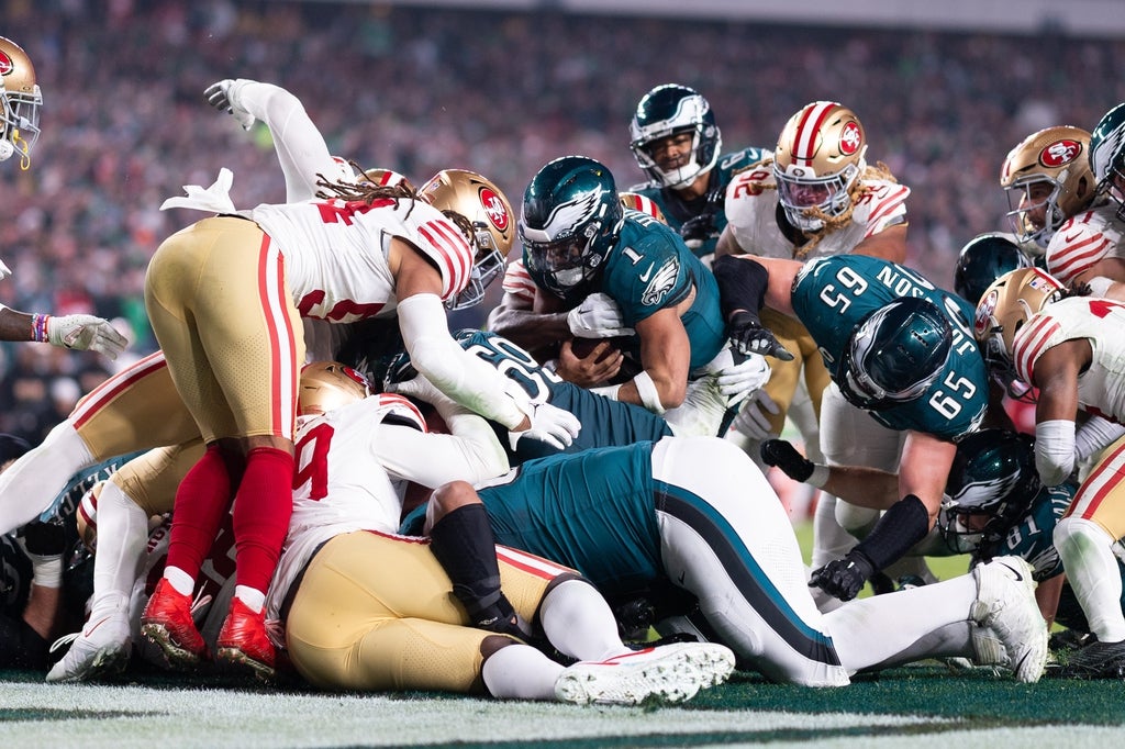 Philadelphia Eagles quarterback Jalen Hurts (1) scores a touchdown on a sneak play against the San Francisco 49ers during the third quarter at Lincoln Financial Field.