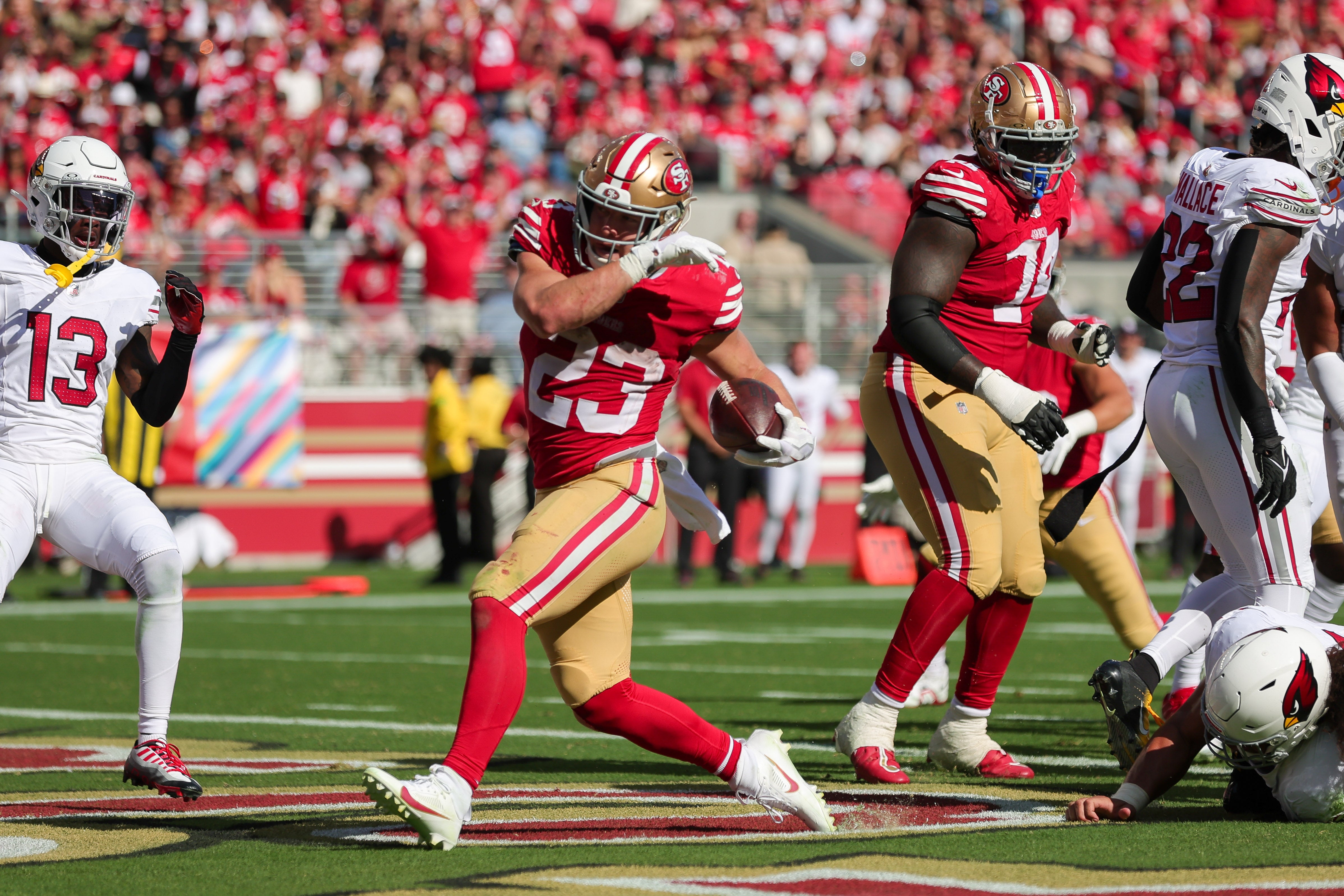 Oct 1, 2023; Santa Clara, California, USA; San Francisco 49ers running back Christian McCaffrey (23) scores a touchdown during the fourth quarter against the Arizona Cardinals at Levi's Stadium.