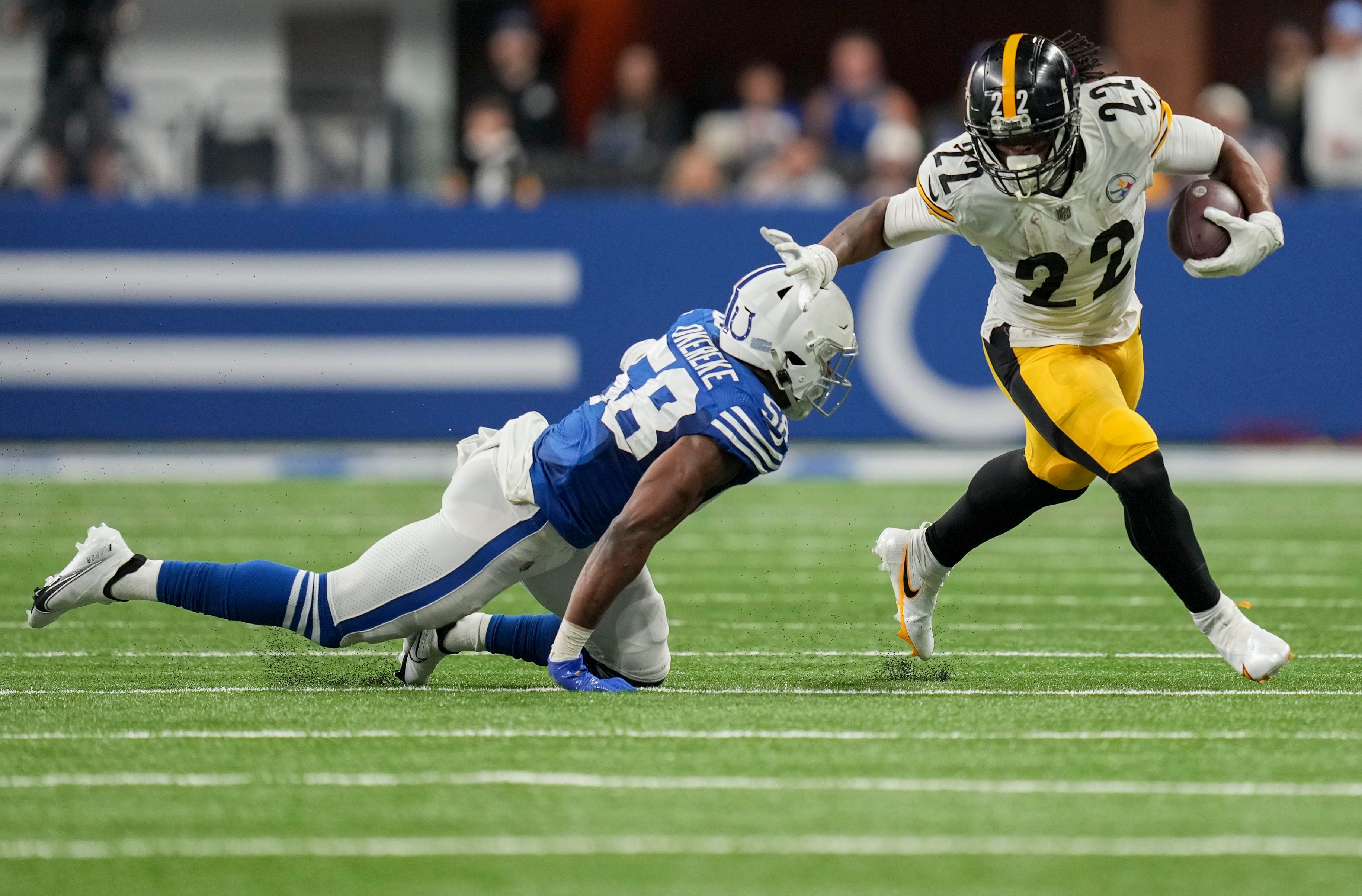 Pittsburgh Steelers running back Najee Harris (22) works to move the ball past Indianapolis Colts linebacker Bobby Okereke (58) on Monday, Nov. 28, 2022, during a game against the Pittsburgh Steelers at Lucas Oil Stadium in Indianapolis.