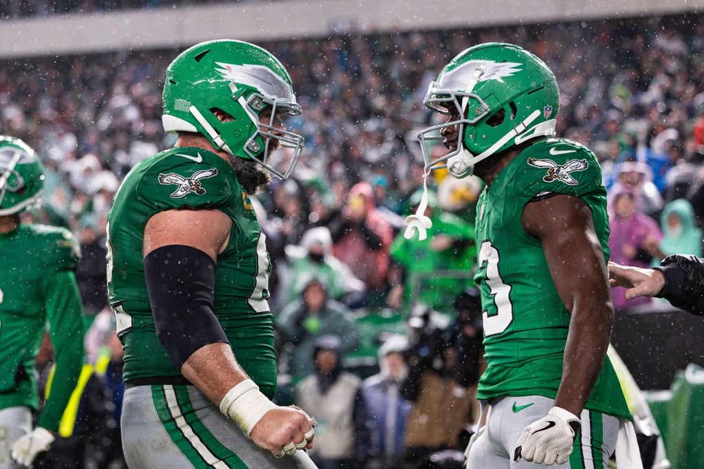Philadelphia Eagles wide receiver Olamide Zaccheaus (13) celebrates with center Jason Kelce (62) after his touchdown catch during the fourth quarter against the Buffalo Bills.