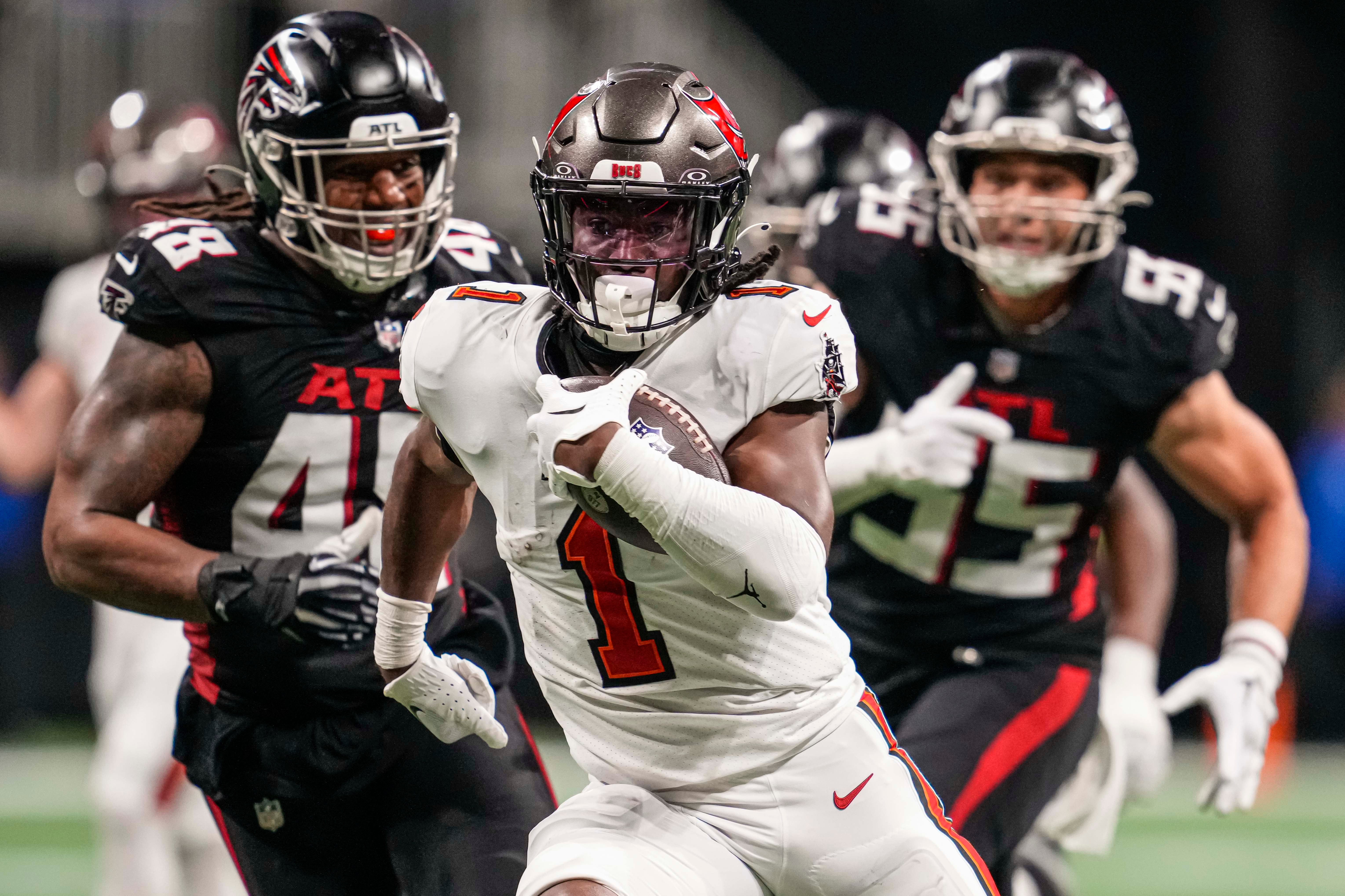 Dec 10, 2023; Atlanta, Georgia, USA; Tampa Bay Buccaneers running back Rachaad White (1) runs for a touchdown against the Atlanta Falcons during the second half at Mercedes-Benz Stadium. Mandatory Credit: Dale Zanine-USA TODAY Sports