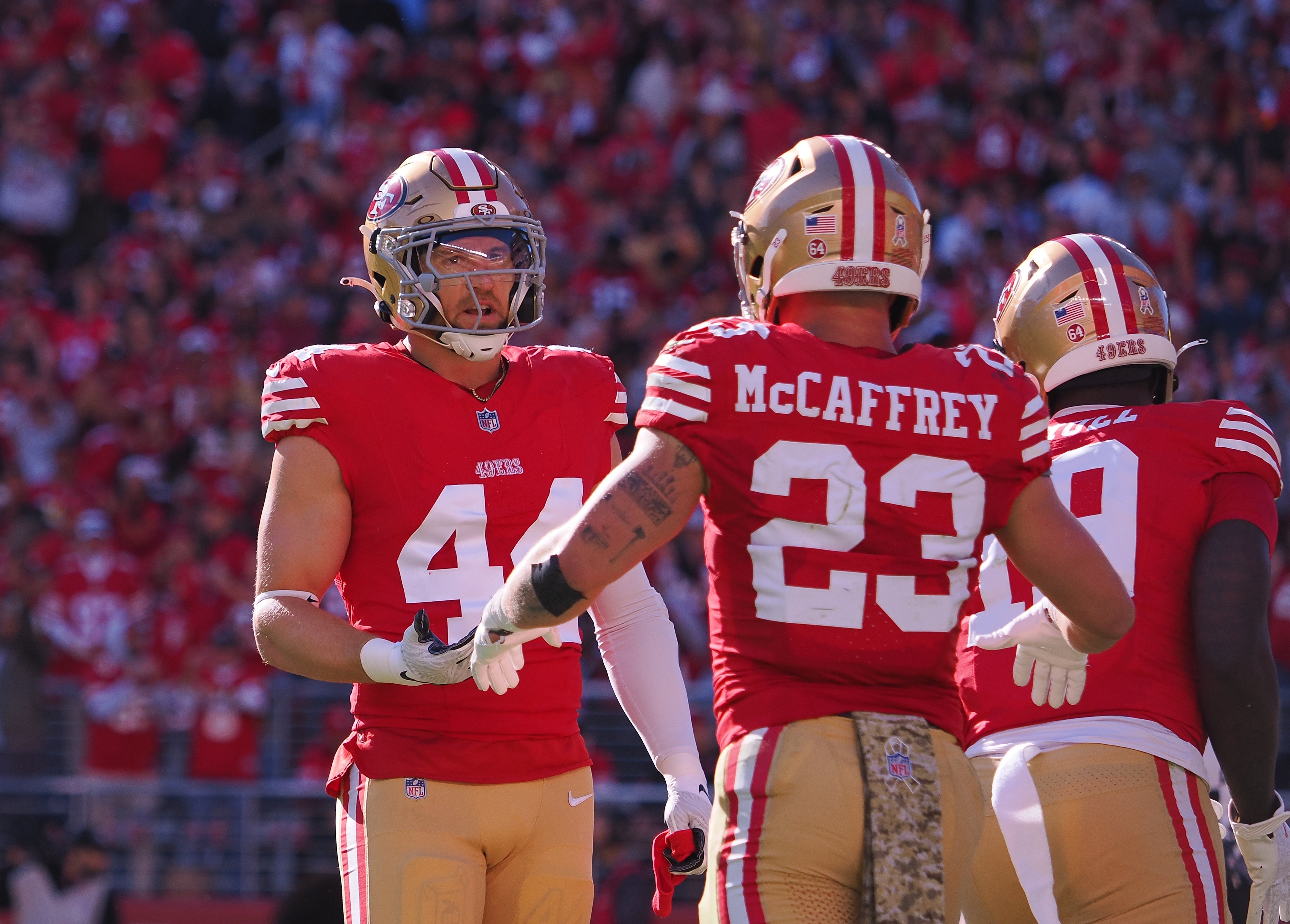 Nov 19, 2023; Santa Clara, California, USA; San Francisco 49ers running back Christian McCaffrey (23) celebrates with fullback Kyle Juszczyk (44) after scoring a touchdown against the Tampa Bay Buccaneers during the first quarter at Levi's Stadium.